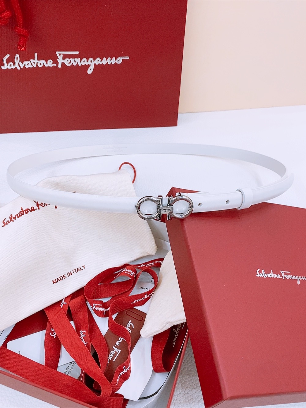 “Stylish Feragamo Gancio Belt for Ms. Filagemu’s Ceremonial Wear”