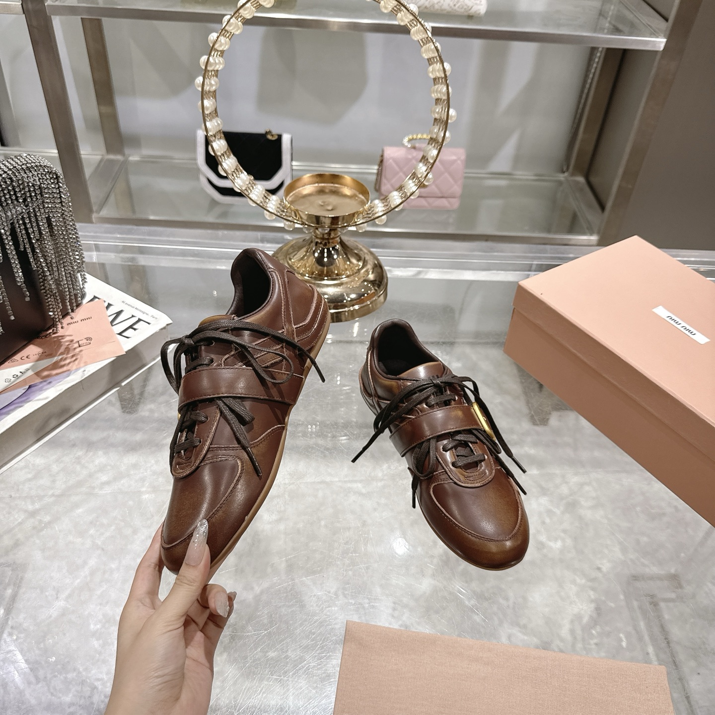 Miu Miu Women's Distressed Leather Sneakers with Buckle Detail, Brown 6 i1744870125868 472 0 3