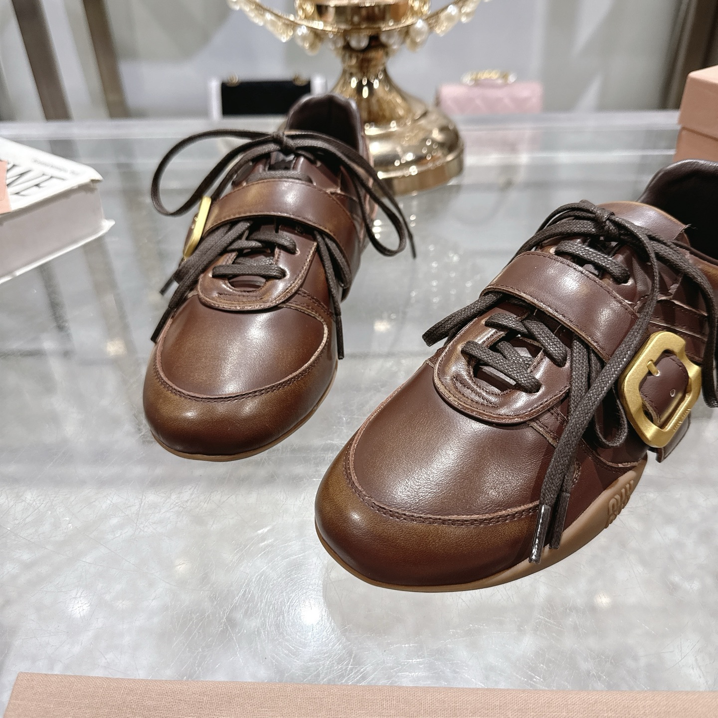 Miu Miu Women's Distressed Leather Sneakers with Buckle Detail, Brown 9 i1744870127266 6152 0 7