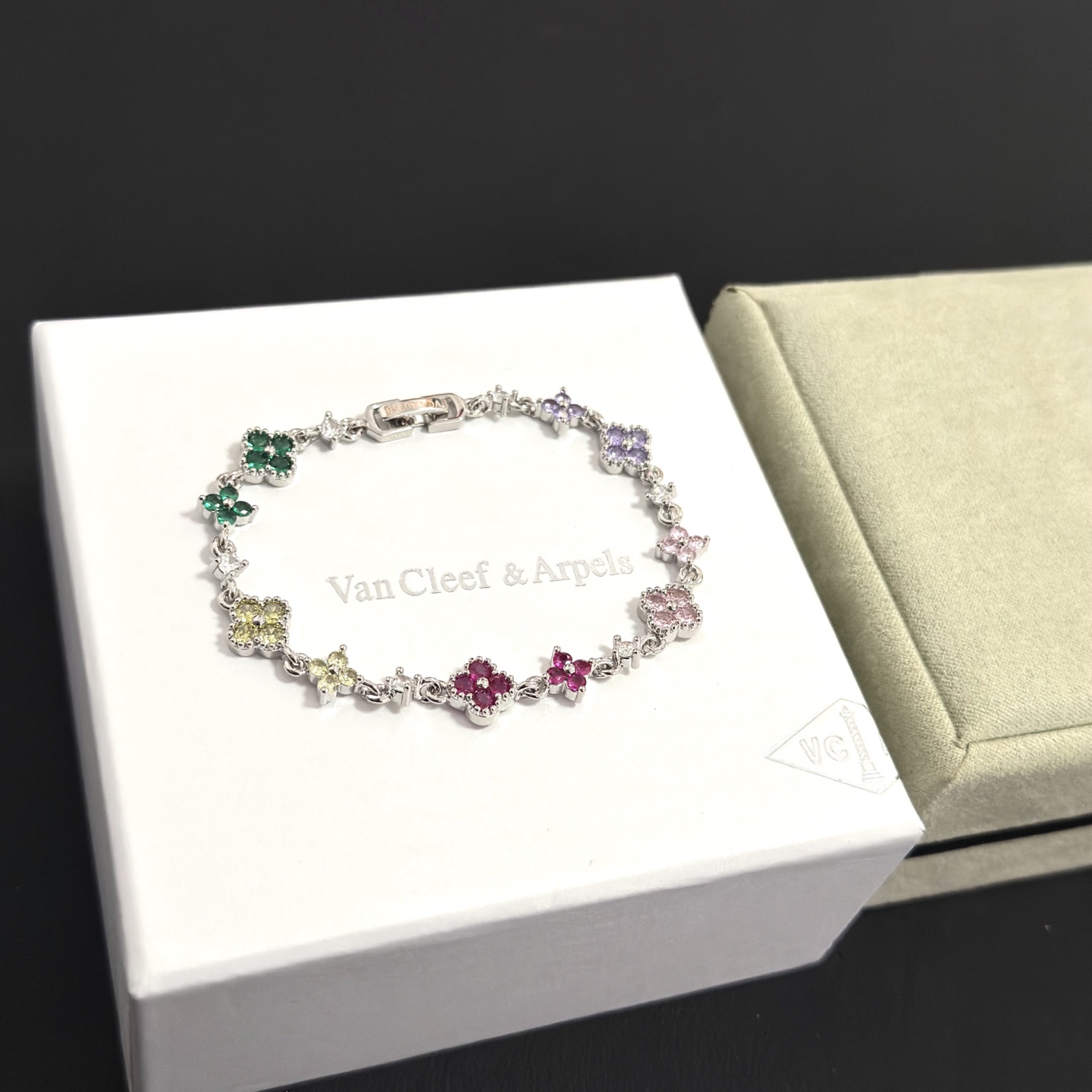 Van Cleef Arpels Alhambra bracelet Silver-toned metal with multicolor gemstones green yellow red pink purple and clear diamond accents 17cm