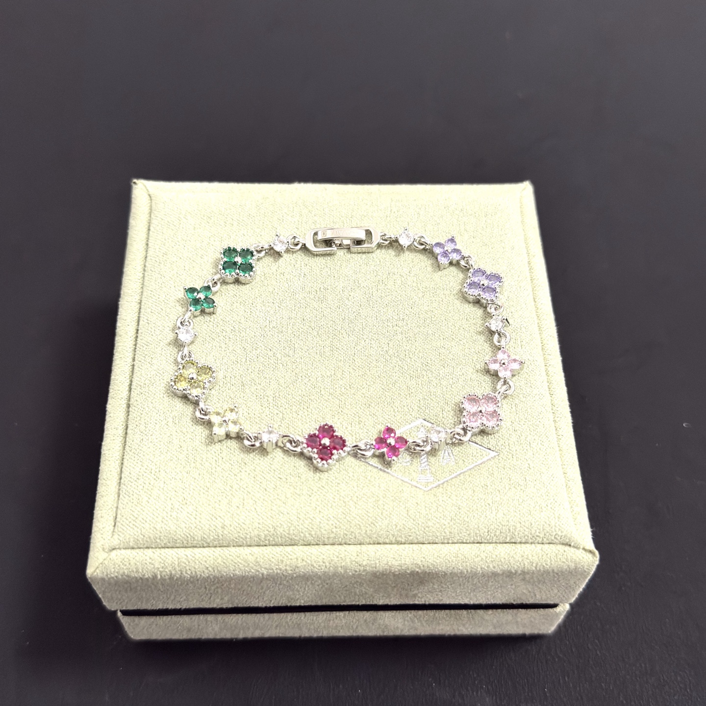 Van Cleef Arpels Alhambra bracelet Silver-toned metal with multicolor gemstones green yellow red pink purple and clear diamond accents 17cm