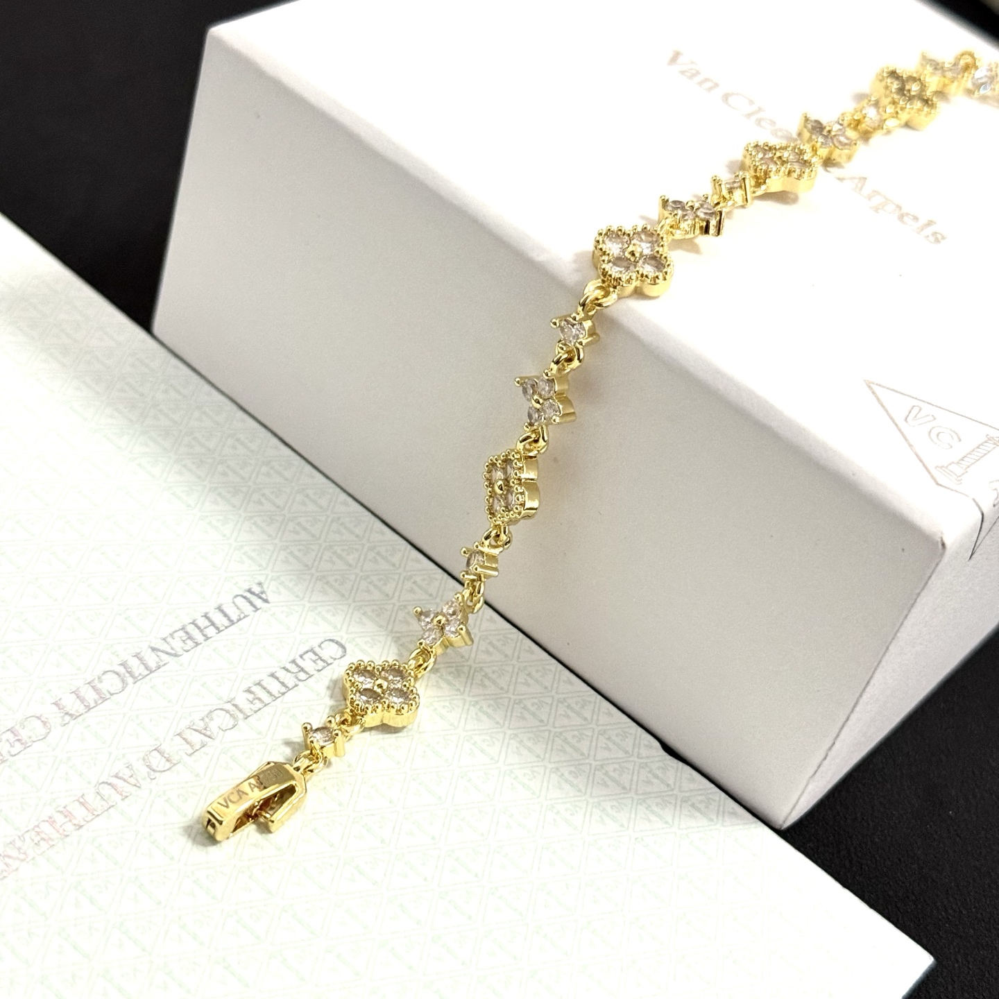 Van Cleef Arpels Alhambra bracelet gold-tone metal with clear diamond-like stones 17cm