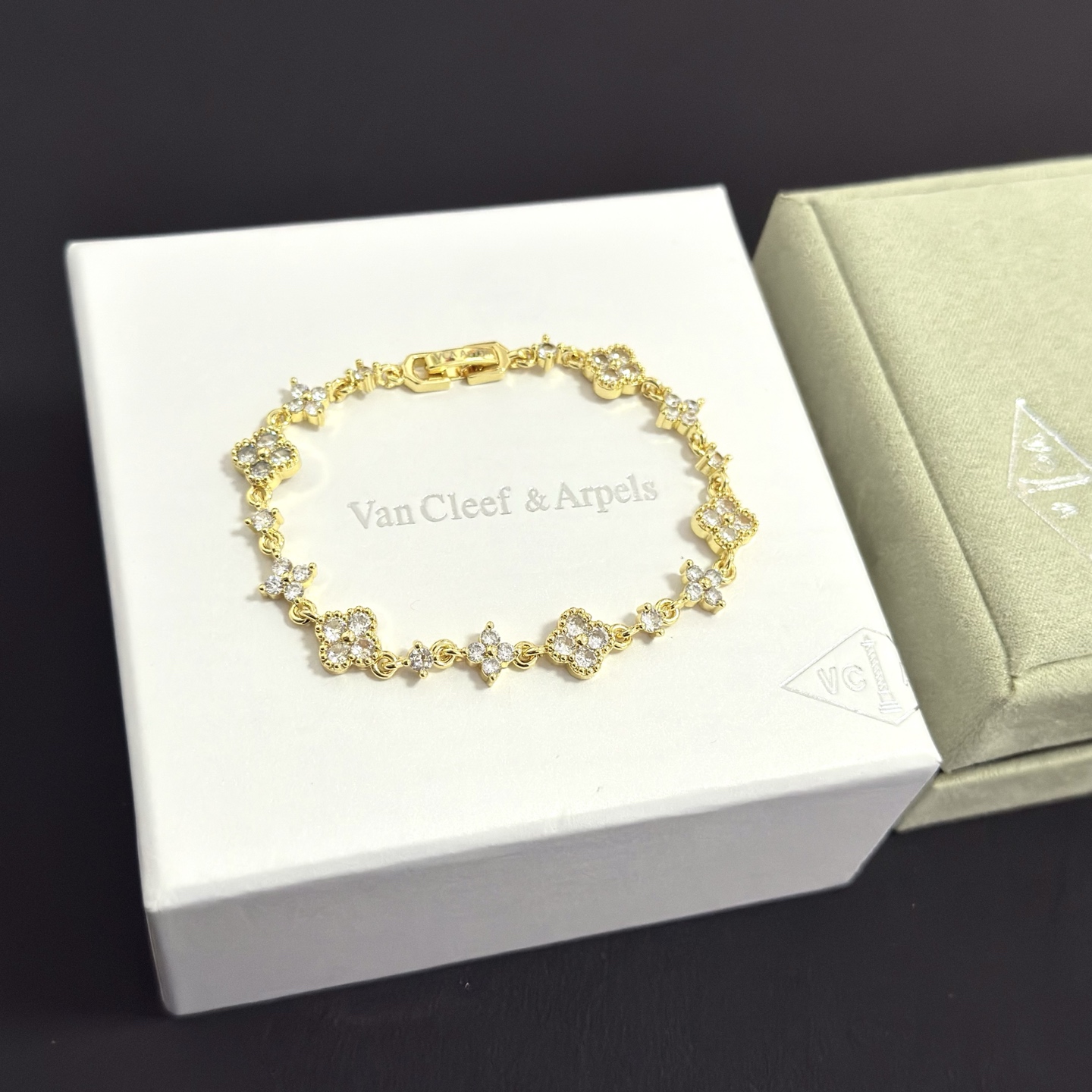 Van Cleef Arpels Alhambra bracelet gold-tone metal with clear diamond-like stones 17cm
