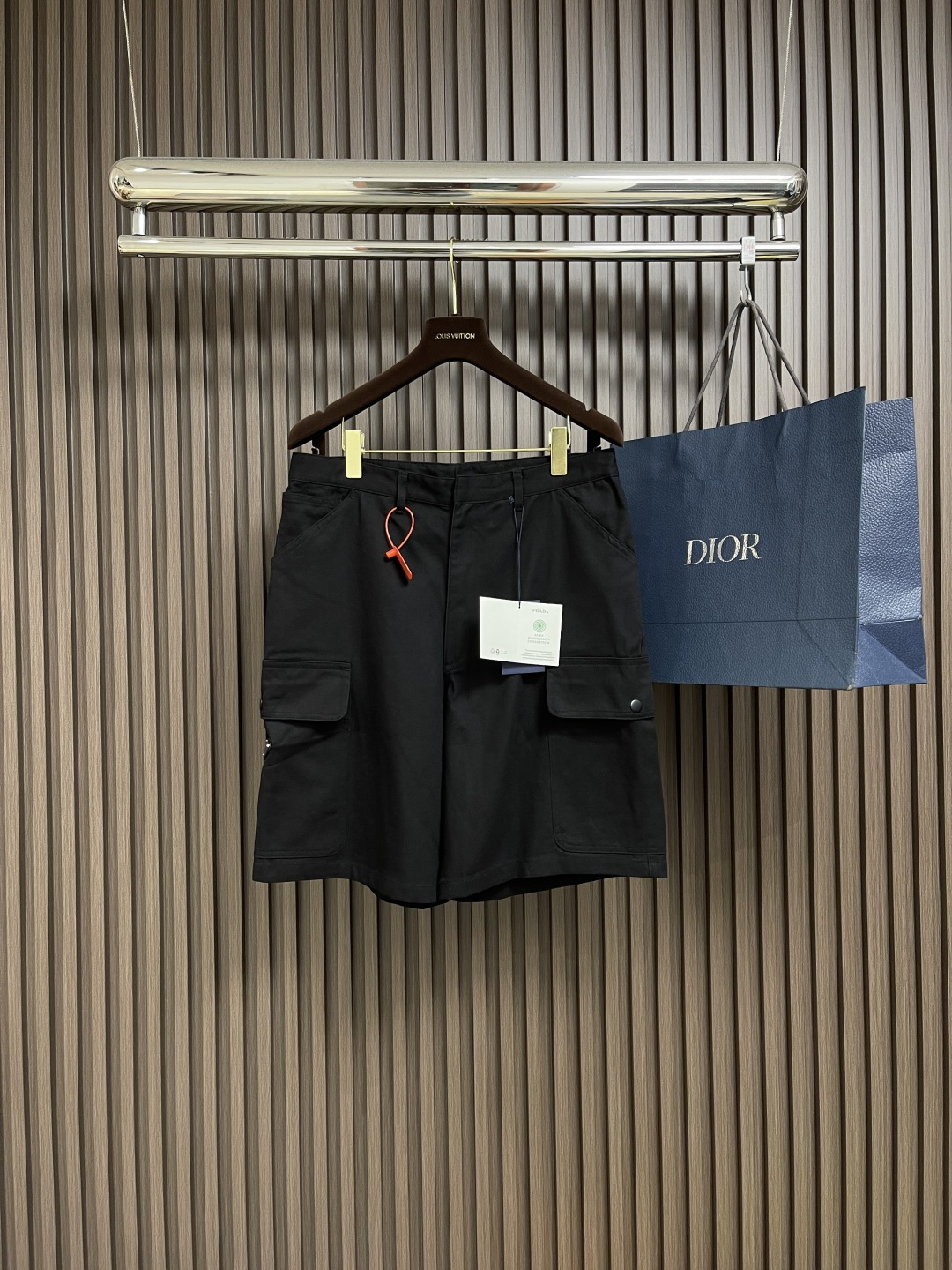 NO:132959,Prada pocket triangle shorts, customized natural tinted velvet cotton material, the side patch bag design is unique, decorated with an enamel triangle metal logo, which increases brand recognition. The infrared position of the 