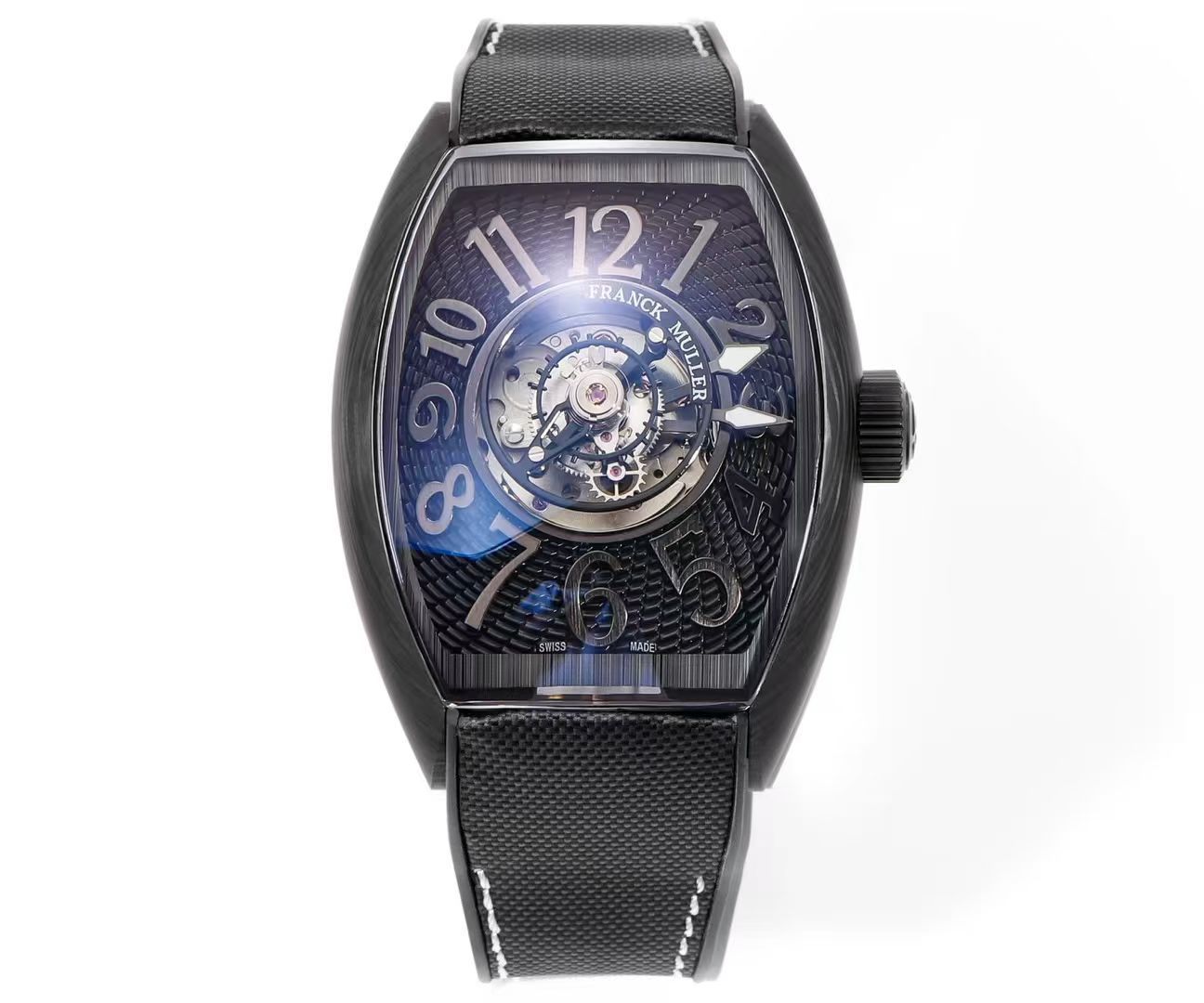 NO:860421,Carbon fiber new watch Franck Muller Franck Muller FM launches Grand Central Tourbillon mid-mounted tourbillon watch Franck Muller launches a new tourbillon watch - 'Grand Central Tourbillon'. What is special is the unique 'central tourbillon' structure, allowing the slowly rotating tourbillon to become the visual focus on the dial. Cintrée Curvex  The barrel-shaped case has been redesigned with slender and smooth lines. The upper and lower ends of the watch mirror extend to the lugs, making the dial more spacious and open. The case is made of carbon fiber with fine texture. The black and gray stripes of carbon fiber create a subtle texture that is both charming and elegant, yet abstract and casual.  The lacquered dial is paired with eye-catching oversized Arabic numerals, and the embossed guilloché texture radiates from the inside out to form a spiral pattern, echoing the rotation of the tourbillon. Since the tourbillon occupies the central position of the dial, the pointer gear train is also modified accordingly, and the pointer is installed on the edge of the tourbillon, as if suspended above the dial. It is equipped with a self-made FM CX 40T-CTR self-winding movement with a swing frequency of 28800vph, providing a power reserve of up to 4 days.  Paired with fluororubber tailor-made nylon strap, new version of special brushed folding clasp true flywheel mechanical watch,19860909碳纤维 新表Franck Muller 法穆兰FM 推出 Grand Central Tourbillon 中置陀飞轮腕表 Franck Muller 推出一枚陀飞轮腕表新作——「Grand Central Tourbillon」,特别之处在于采用独特的「中置陀飞轮」结构,让缓慢旋转的陀飞轮成为表盘上的视觉焦点. Cintrée Curvex 桶形表壳经过重新设计,线条纤细而流畅,表镜上下两端延伸至表耳,让表盘更加宽敞开阔.表壳以碳纤维打造,纹理细腻,碳纤维的黑色和灰色条纹营造出微妙的质感,既迷人优雅,又抽象随意. 漆面表盘,搭配醒目的超大尺寸阿拉伯数字时标,压印玑镂纹理由内而外发散形成螺旋图案,呼应着陀飞轮的旋转.由于陀飞轮占据了表盘的中央位置,指针齿轮系也相应改造,指针被安装在陀飞轮边缘,如同悬浮于表盘之上. 搭载自制 FM CX 40T-CTR 自动上链机芯,摆频28800vph,提供长达4天的动力储备. 搭配氟橡胶裁缝尼龙表带,新版专用款拉丝工艺折叠表扣真飞轮机械腕表,,,Watch
