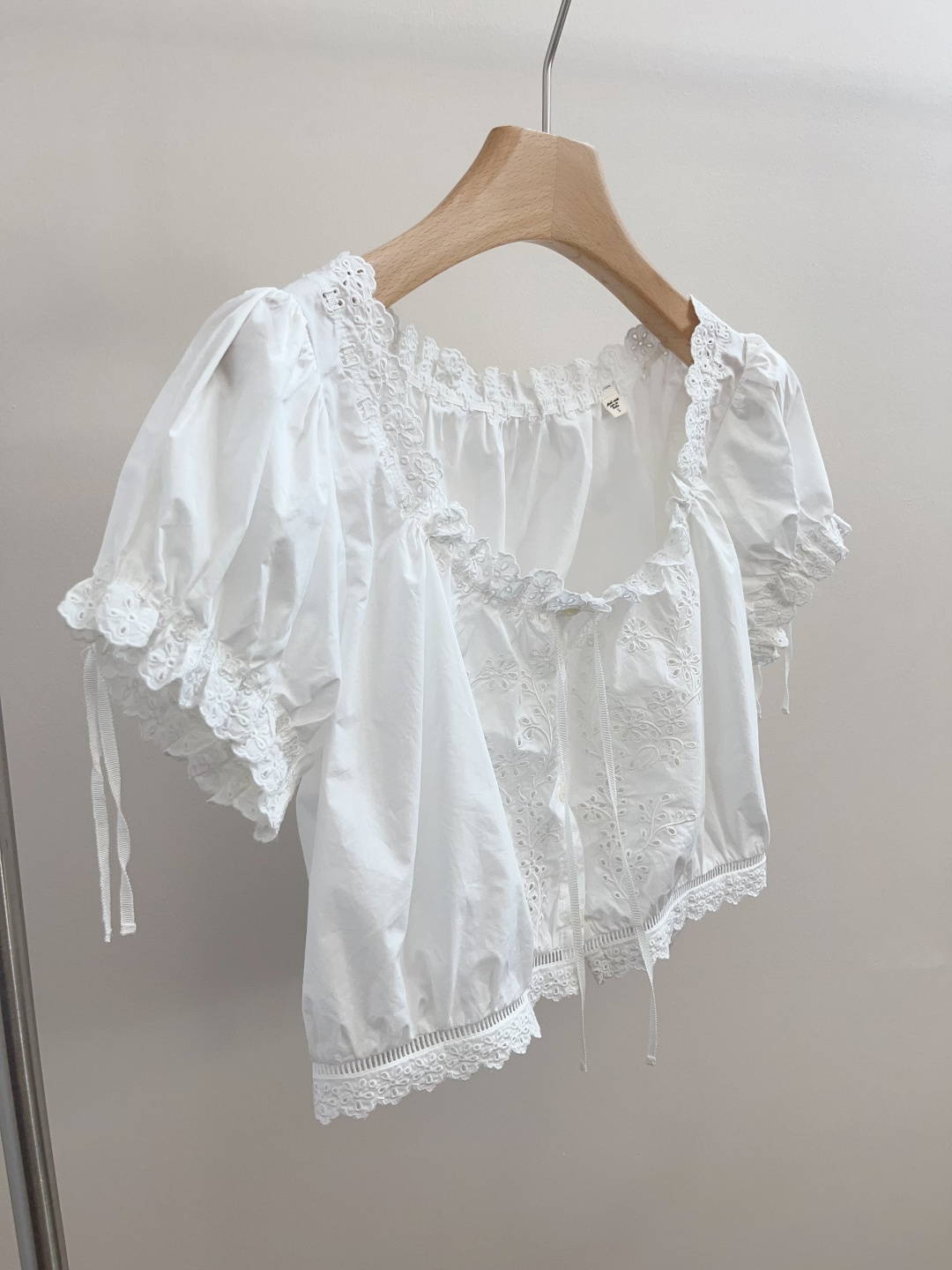 Dôen Hollow Out Embroidered Lace Tie-Neck Cropped Blouse