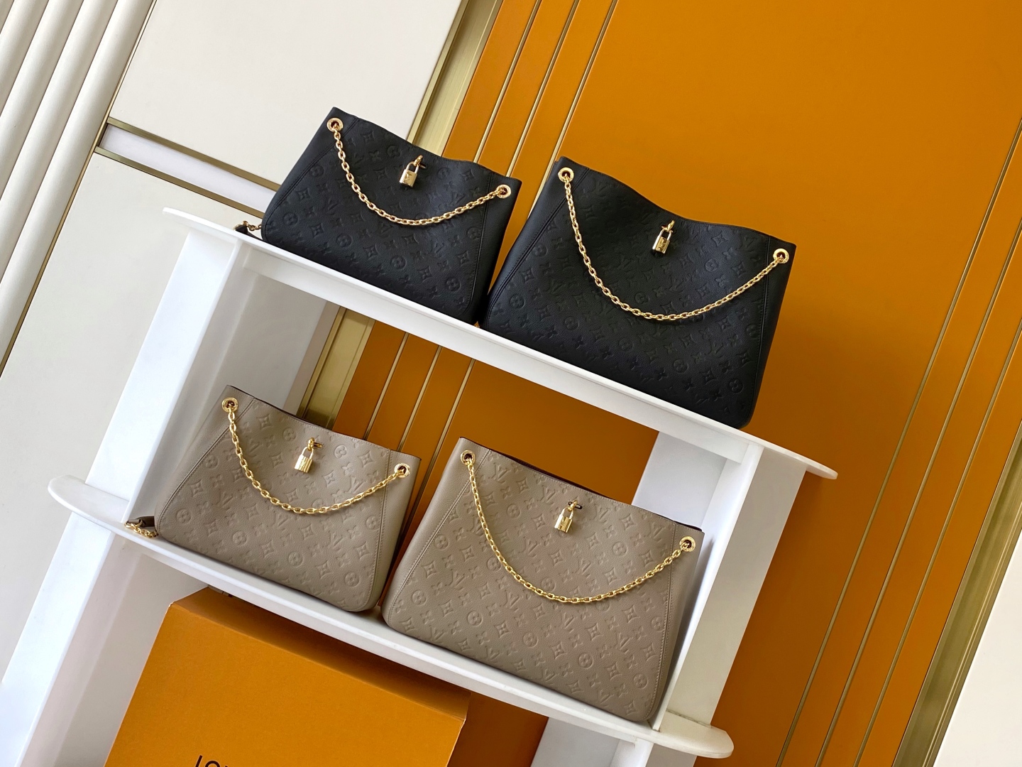 Louis Vuitton Embossed Leather Shoulder Bag with Chain Accent - Stylish & Versatile
