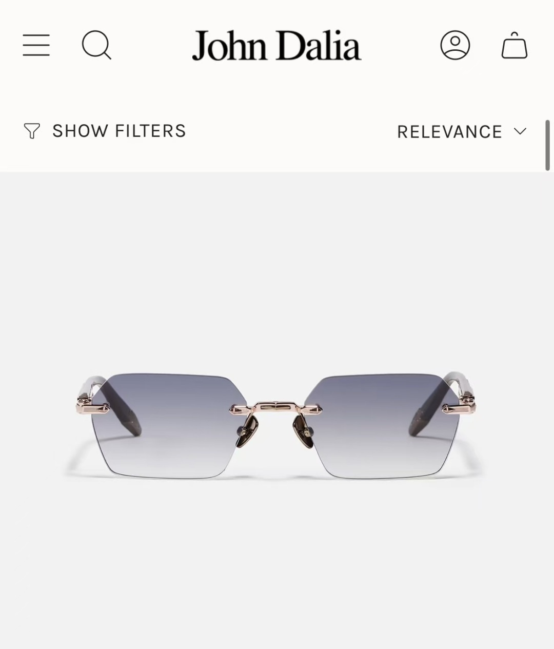 JOHN DALIA R03眼镜，尽显永恒优雅——这款男女皆宜的无框眼镜，兼具精致与舒适。圆角矩形镜框轮廓，宽阔的凹槽鼻
