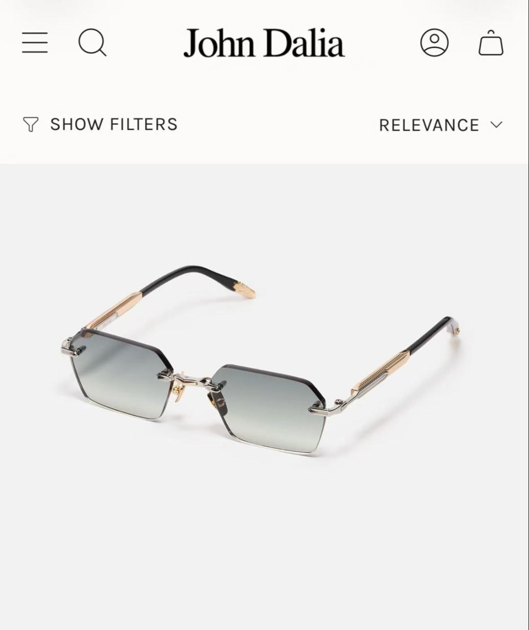 JOHN DALIA R03眼镜，尽显永恒优雅——这款男女皆宜的无框眼镜，兼具精致与舒适。圆角矩形镜框轮廓，宽阔的凹槽鼻