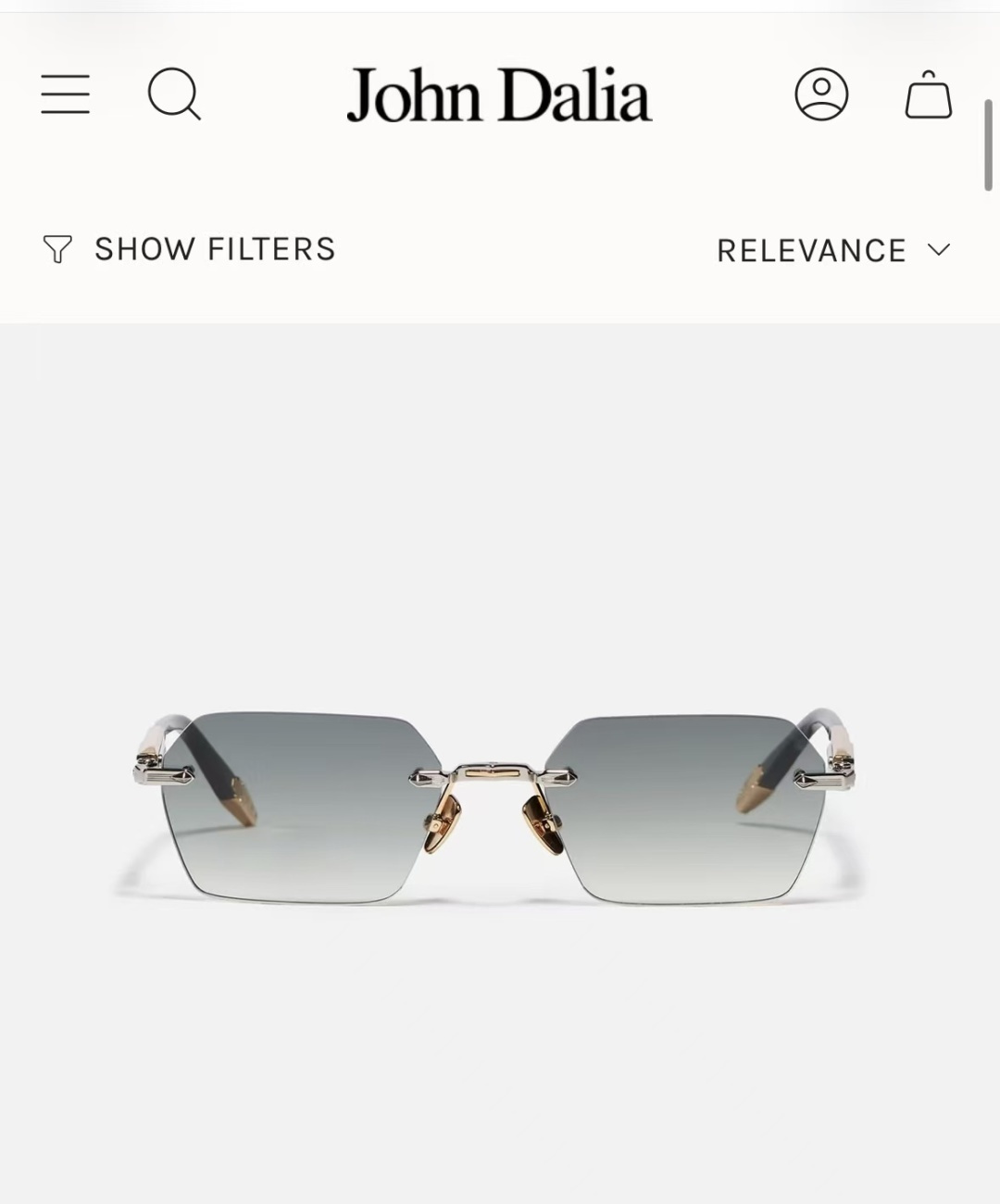 JOHN DALIA R03眼镜，尽显永恒优雅——这款男女皆宜的无框眼镜，兼具精致与舒适。圆角矩形镜框轮廓，宽阔的凹槽鼻
