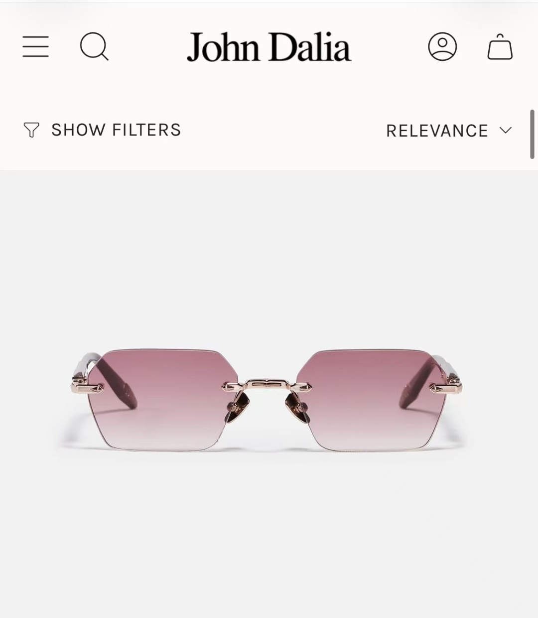 JOHN DALIA R03眼镜，尽显永恒优雅——这款男女皆宜的无框眼镜，兼具精致与舒适。圆角矩形镜框轮廓，宽阔的凹槽鼻