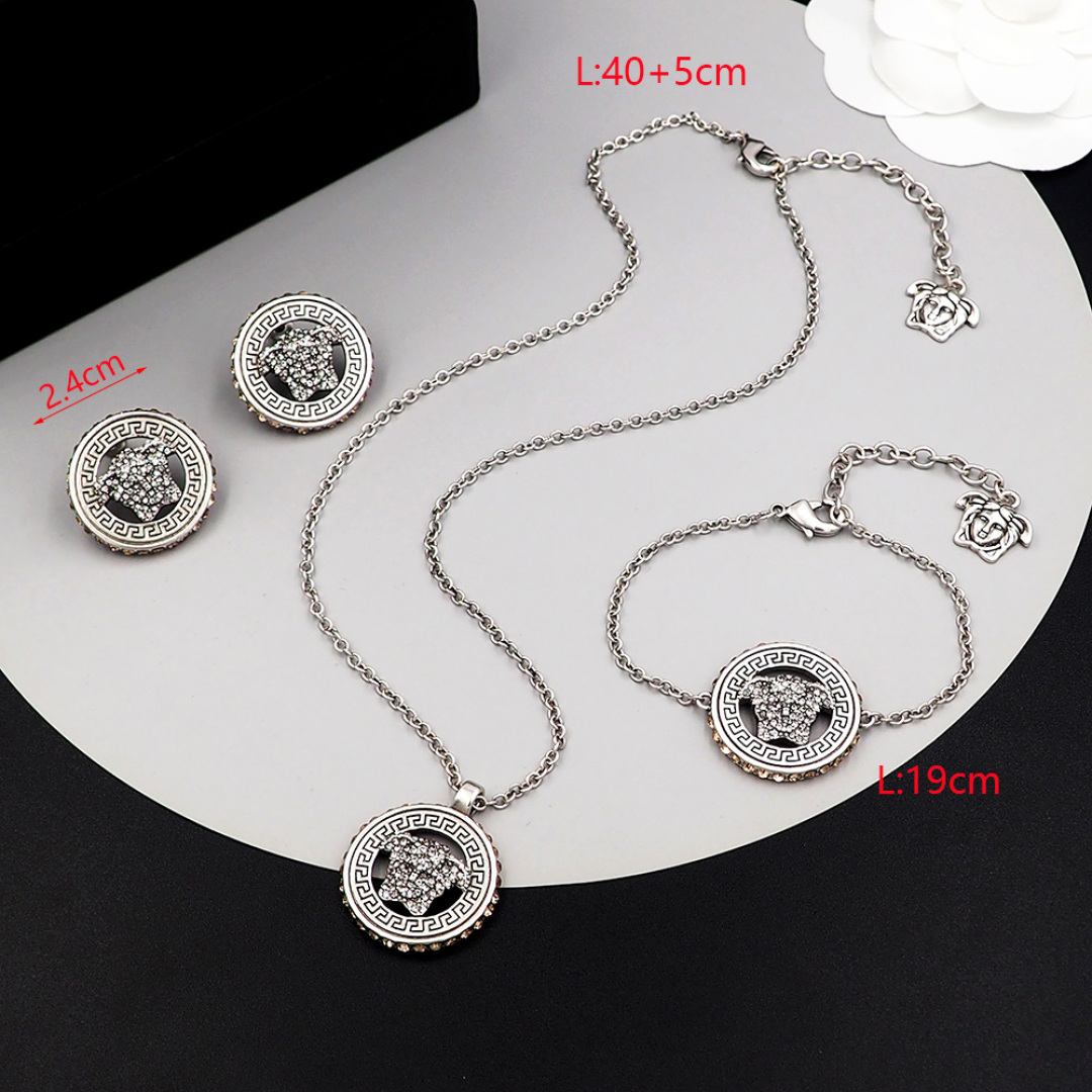 Queen Versace Medusa’s head looks like a wall tattoo. The necklace, 113. Handcuffs, 113. An earring 113