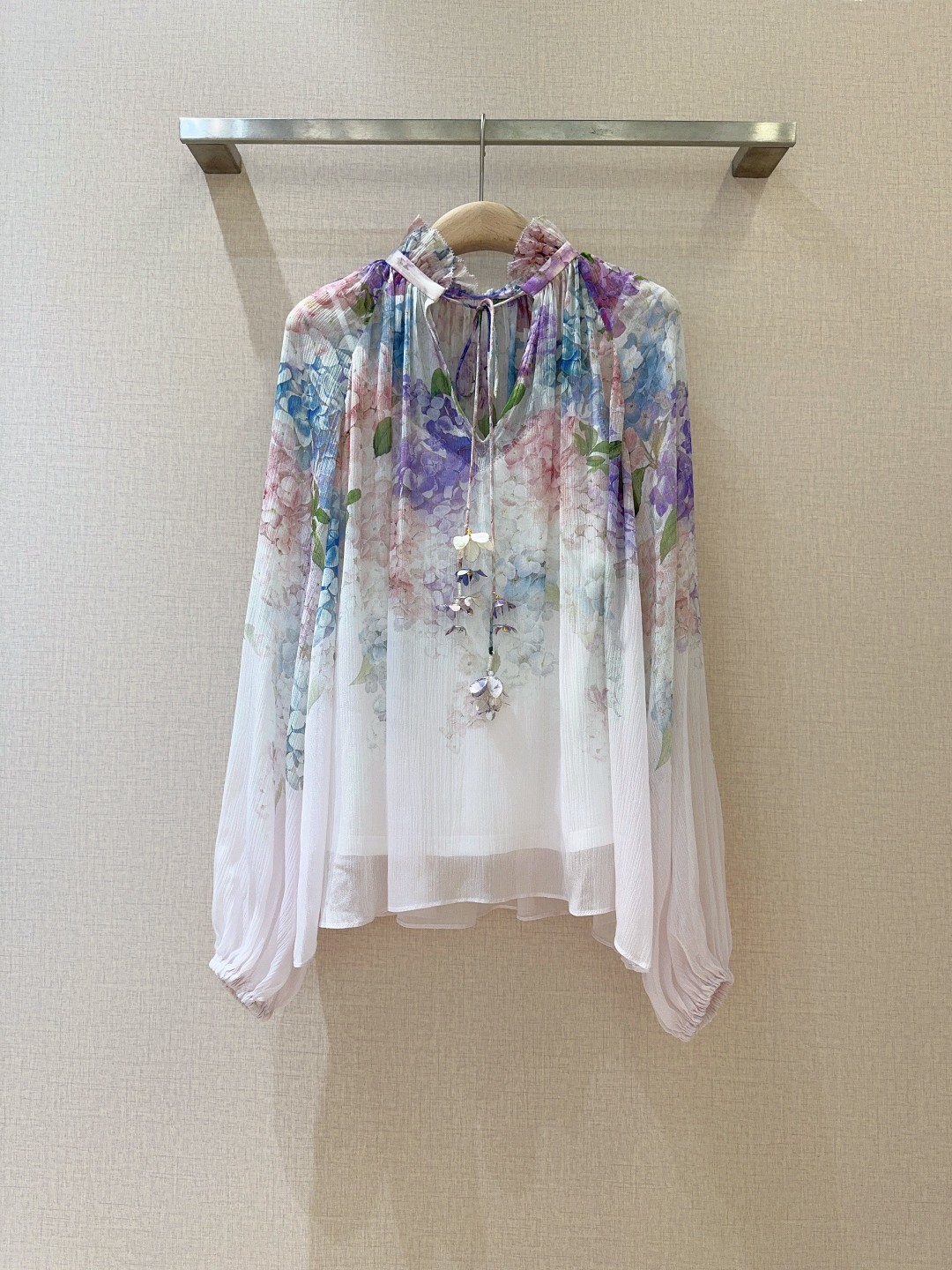 Title: ZIMMERMANN Lantern Shirt for Women Description Summary: ZIMMERMANN’s new lantern shirt for women features a multi-color embroidery pattern, long sleeves, loose fit, tie