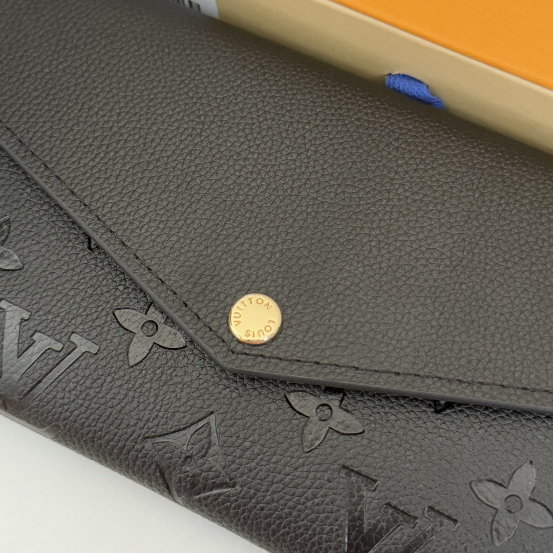 モノグラムエンプリントレザーのサラ財布 - スタイリッシュで機能的