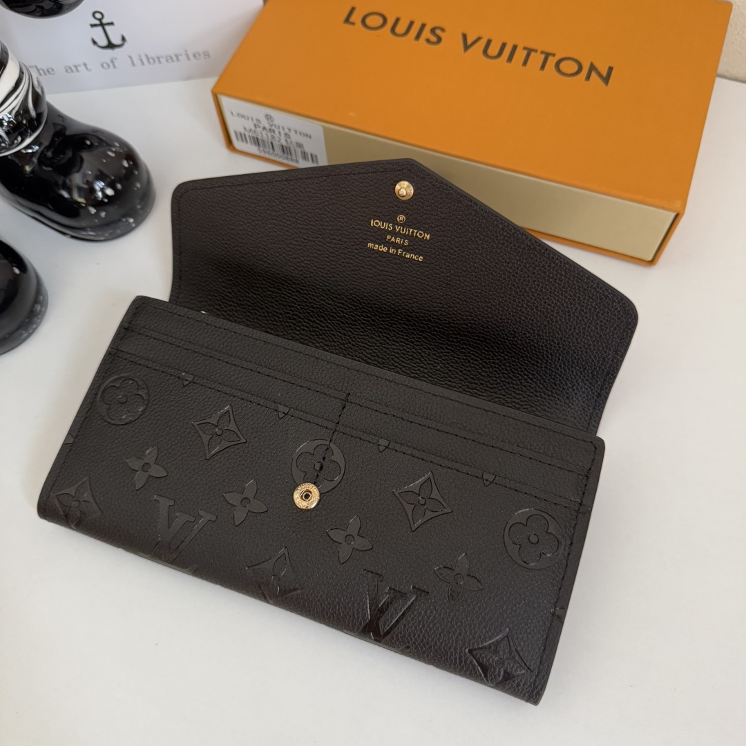 モノグラムエンプリントレザーのサラ財布 - スタイリッシュで機能的