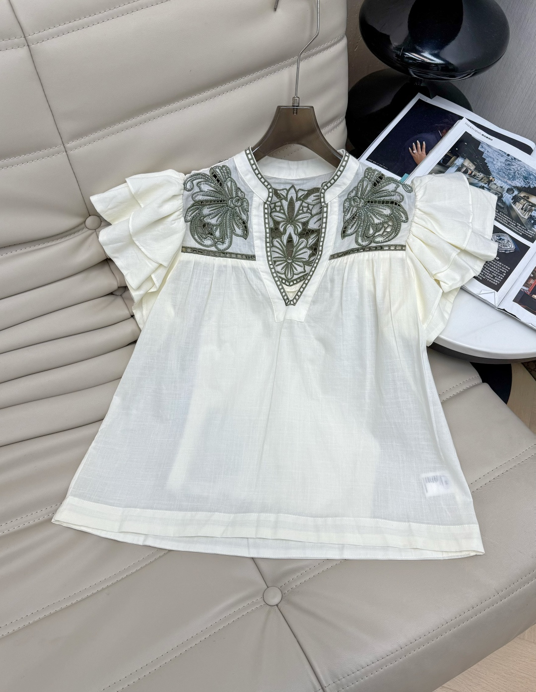 NO:898888,The 26 spring and summer series V-neck flying sleeve hollow top is made of light and slightly transparent kapok blended fabric. It is cool and breathable to wear, perfect for summer!  V-neck version, green plant embroidery and hand-beading, full of details ~ full of French romantic atmosphere. The flying sleeve design is smart and elegant, and the loose version is super friendly to the figure, making it easy to create a lazy and casual summer look ~ SML,,1986090926春夏系列V领飞飞袖镂空上衣,采用轻薄微透木棉混纺面料,穿着清凉透气,超适合夏天！V领版型 绿色植物刺绣手工钉珠 细节满满~法式浪漫氛围感拉满 飞袖设计灵动飘逸,宽松版型对身材超友好,轻松打造慵懒随性夏日look～SML,,,Women's clothing
