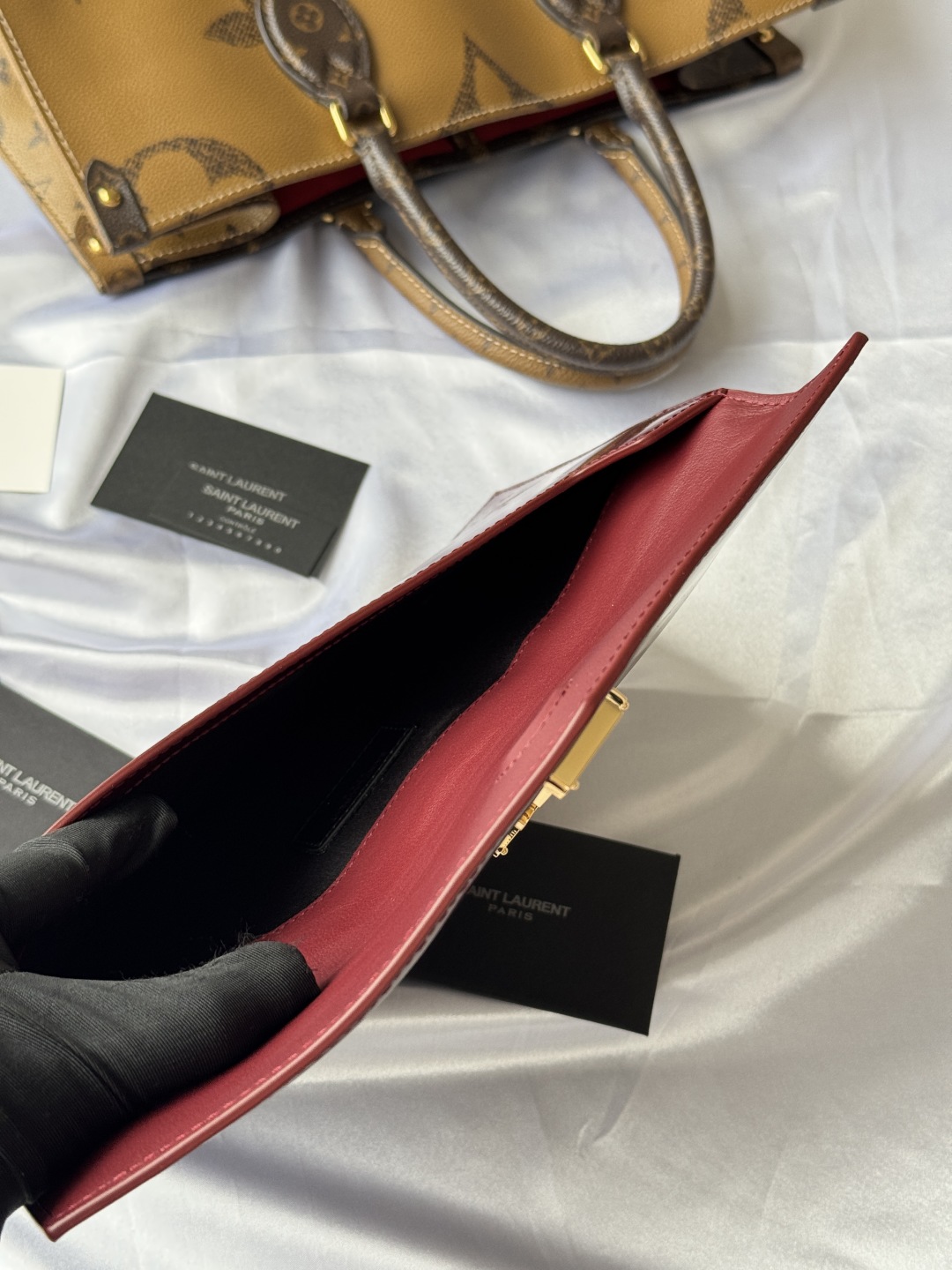 Saint Laurent Paris Clutch in Burgundy Patent Leather with Gold Logo 7 cmp i1743756904144 7199 0 6