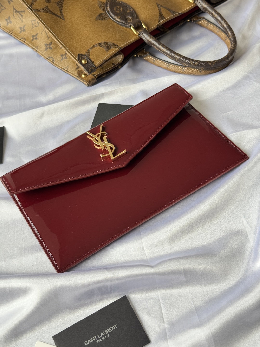 Saint Laurent Paris Clutch in Burgundy Patent Leather with Gold Logo 3 cmp i1743756910133 8833 0 2