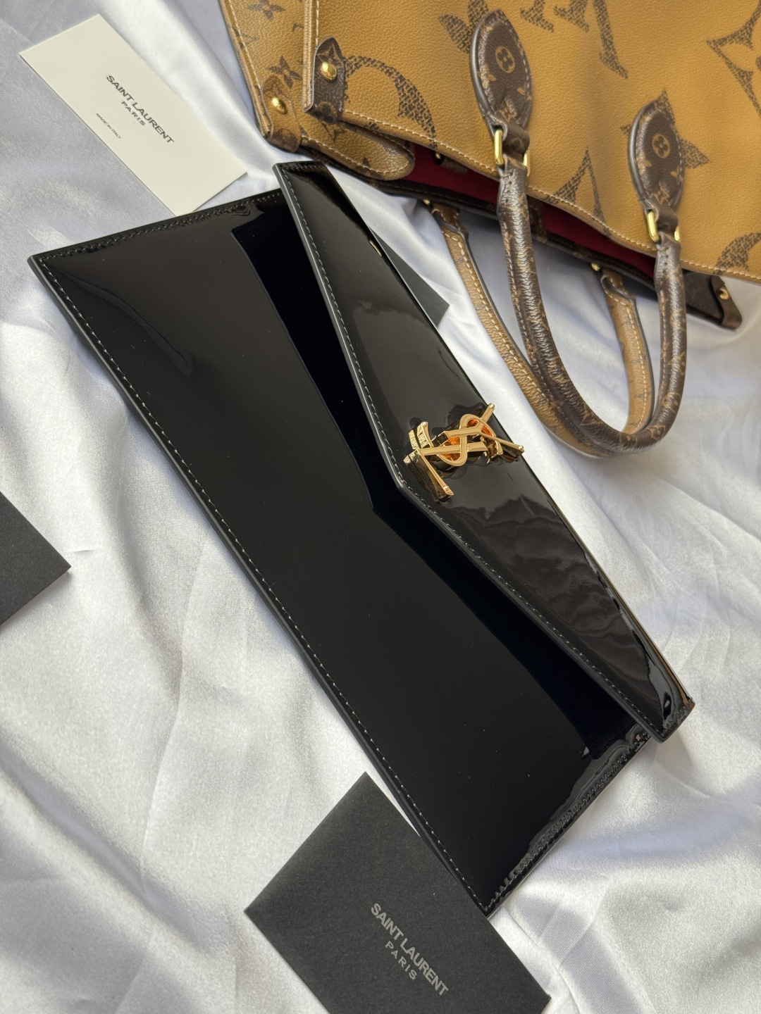 Yves Saint Laurent Black Patent Leather Clutch with Gold Logo 5 cmp i1743757038319 2849 0 3