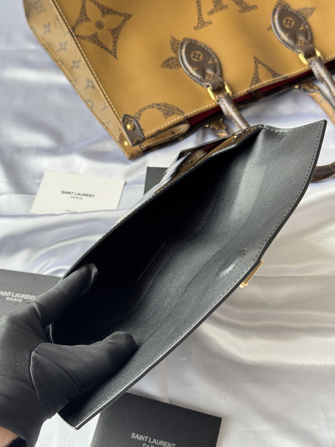 Yves Saint Laurent Black Patent Leather Clutch with Gold Logo 10 cmp i1743757047468 5655 0 8