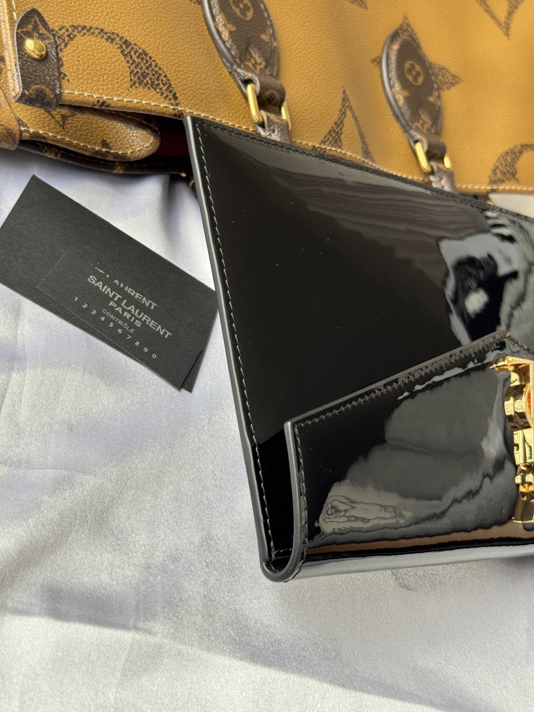 Yves Saint Laurent Black Patent Leather Clutch with Gold Logo 7 cmp i1743757047512 145 0 5
