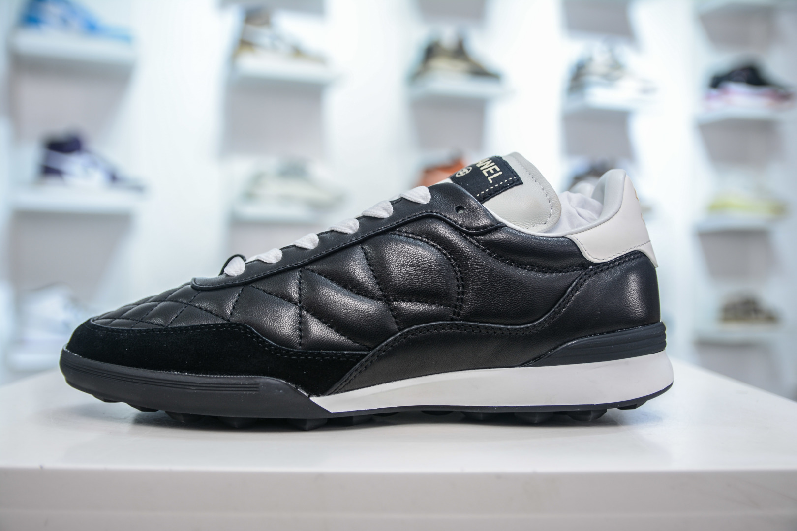 Chanel Women's Black Leather & Suede Round-Toe Quilted Low Top Sneakers