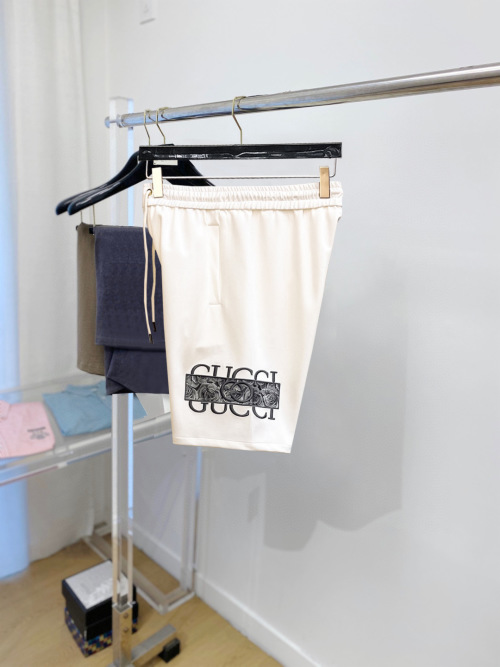 Gucci Men's Ivory Cotton Blend Shorts with Floral Logo Print 1 Gucci Men's Ivory Cotton Blend Shorts with Floral Logo Print