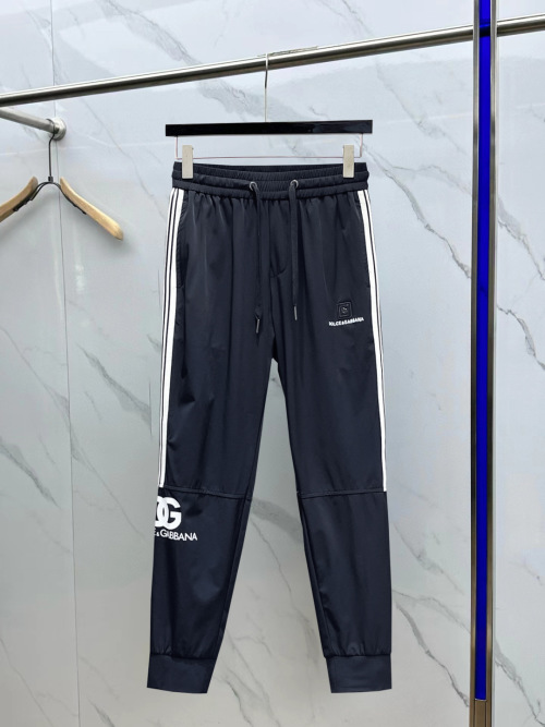 DOLCE&GABBANA Pantalon de survêtement avec logo et bandes latérales 1 DOLCE&GABBANA Pantalon de survêtement avec logo et bandes latérales