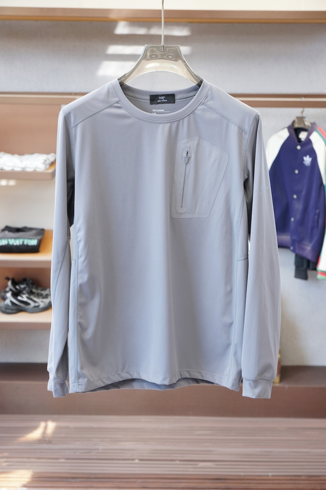 始祖鸟-秋冬户外男士RHO LT系列运动健身休闲弹力超柔轻量针织长袖衫，薄绒内里套头圆领无缝压胶拉链口袋