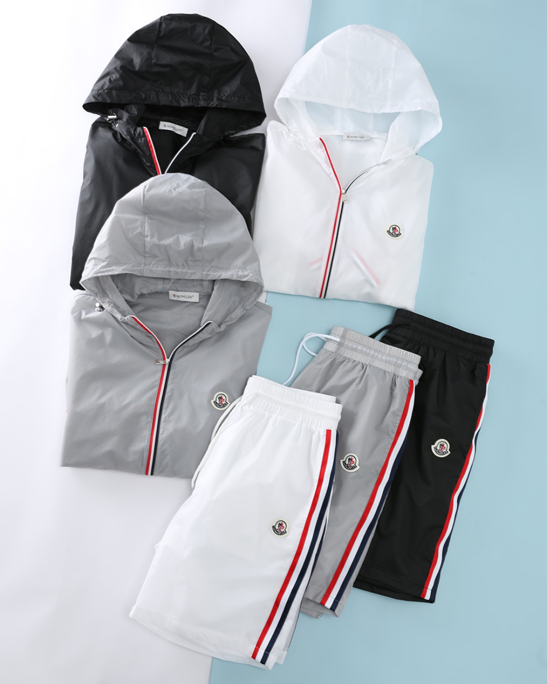 NO:904331,A set is not sold separately. Mon* buckle 2026 summer new style, men's classic three-color striped webbing decoration, fashionable non-detachable hooded sun protection jacket + shorts set!  Men's casual suit that cleverly combines M's iconic French three-color stripes with modern functional design. It is specially designed for urban men who pursue high-end texture and comfortable experience. It is a must-have item for spring and summer that combines style and practicality. It is made of imported high-density lightweight sunscreen fabric, lightweight nylon fabric with subtle checkered texture, and comes with UPF  It has sun protection properties and is water-repellent, which can cope with sudden light rain. The fabric is smooth and skin-friendly, breathable and not sweaty. It is not easy to deform after long-term wear and maintains a neat fit for a long time. There are wool emblem labels on the chest of the body and the left front side of the shorts, using high-density embroidery technology and lines.  Neat and full, low-key to highlight the brand identity; the metal zipper pull also carries the brand logo, which is a reflection of the ingenuity in the details. The red, white and blue three-color webbing in the middle of the sleeves and the sides of the shorts adds a touch of bright color to the simple body, which is both decorative and brand-recognizable. Adjustable  The hooded design is matched with the main body zipper opening and closing, making it easy to put on and take off while providing additional protection. The red, white and blue three-color webbing on both sides of the zipper echoes the brand's iconic elements and enhances the recognition of the shape. The jacket adopts a straight and loose fit, which is not flattering on the figure; the shorts are straight  Five-quarter pants, just above the knees, modify the shape of the legs without being too picky, and are suitable for various body types. The hem, cuffs and waistband are elasticated, which can not only prevent wind, but also ensure wearing comfort, and easily create a simple and advanced visual effect. Item No. 505-33  Size 48/M-56/3XL Jacket 48 Shoulder width 45 Bust 108 Clothing length 66 Sleeve length 62 50 Shoulder width 47 Bust 112 Clothing length 67 Sleeve length 63 52 Shoulder width 49 Bust 116 Clothing length 68 Sleeve length 64 54 Shoulder width 51 Bust 118 Clothing length 70 Sleeve length 65 56  Shoulder width 53 Bust 122 Length 72 Sleeve length 66 Shorts 48 Waist 72-90 Hips 110 Straight 29 Pants length 48 50 Waist 76-94 Hips 114 Straight 29 Pants length 49 52 Waist 80-98 Hips 118 Straight 30 Pants length 50 54 Waist 84-102 Hips 122 Straight 30  Pants length 51 56, waist 88-106, hips 126, straight stop 31, pants length 52, shorts, jackets & coats, hats,19860909一套 不拆卖 Mon*扣 2026夏季新款新款,男士经典三色条纹织带装饰时尚不可拆卸连帽防晒夹克+短裤套装！M家标志性的法式三色条纹与现代机能设计巧妙融合的男士休闲套装,专为追求高级质感与舒适体验的都市男士打造,是兼顾格调与实用性的春夏必备单品. 选用进口高密轻量防晒面料,带有细微格纹肌理的轻量尼龙面料,自带 UPF 防晒属性,同时具备防泼水处理,可应对突发小雨.面料触感顺滑亲肤,透气不闷汗,久穿不易变形,长久保持利落版型.衣身胸前与短裤左前侧均带有羊毛徽标签,采用高密刺绣工艺,线条工整饱满,低调彰显品牌身份；金属拉链头同样带有品牌标识,是细节处的匠心体现.双袖中部与短裤侧边的红白蓝三色织带,为简约的衣身增添了一抹亮色,兼具装饰性与品牌辨识度.可调节连帽设计,搭配主身拉链开合,穿脱便捷,同时提供额外的防护.拉链两侧的红白蓝三色织带,呼应品牌标志性元素,提升了造型的辨识度.夹克采用直筒宽松版型,不挑身材；短裤为直筒五分裤型,刚好到膝盖上方,修饰腿型的同时不挑身材,适配各种体型.下摆、袖口与裤腰采用松紧设计,既能防风,也能保证穿着的舒适感,轻松打造简约高级的视觉效果.货号505-33 尺码48/M-56/3XL 夹克 48 肩宽45胸围108衣长66袖长62 50 肩宽47胸围112衣长67袖长63 52 肩宽49胸围116衣长68袖长64 54 肩宽51胸围118衣长70袖长65 56 肩宽53胸围122衣长72袖长66 短裤 48 腰围72-90臀围110直挡29 裤长48 50 腰围76-94臀围114直挡29 裤长49 52 腰围80-98臀围118直挡30 裤长50 54 腰围84-102 臀围122直挡30 裤长51 56 腰围88-106 臀围126直挡31 裤长52,,shorts,jackets & coats,hats,,Men's clothing