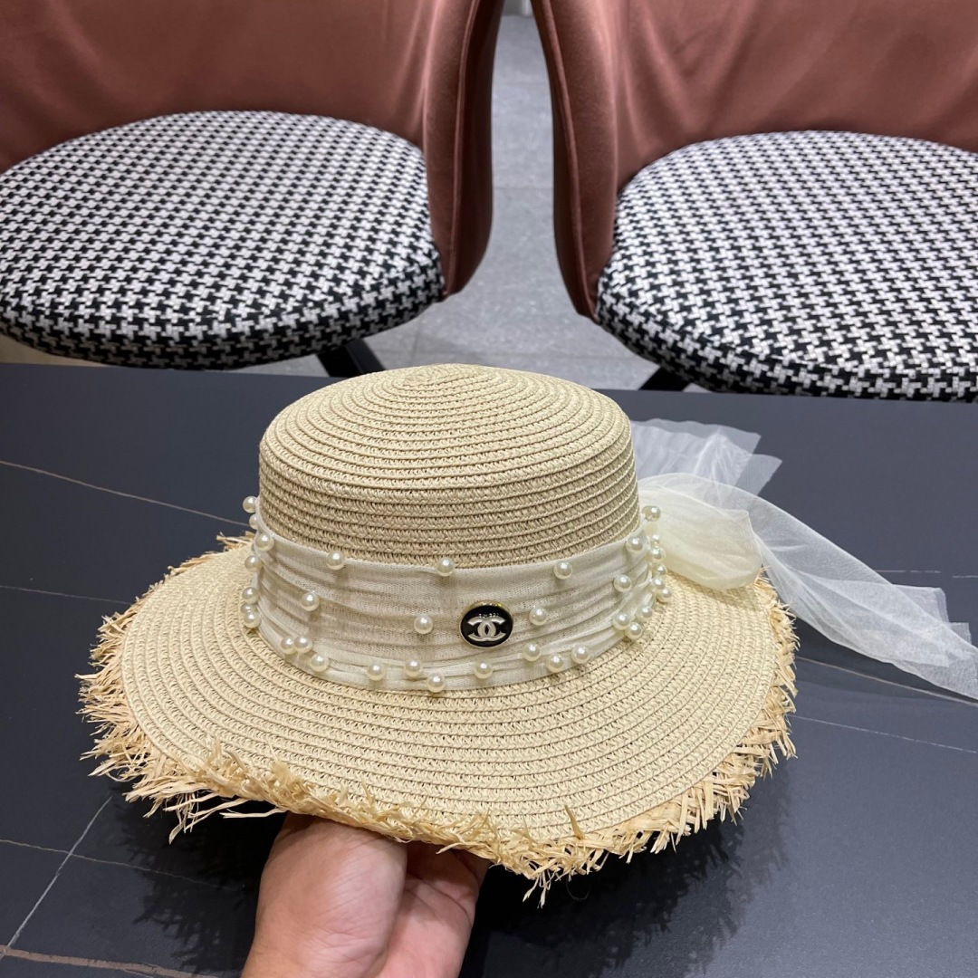  香奈儿Chanel 2025蝴蝶结草编帽子平顶珍珠毛边草帽女大帽檐夏季海
边沙滩遮阳防晒帽