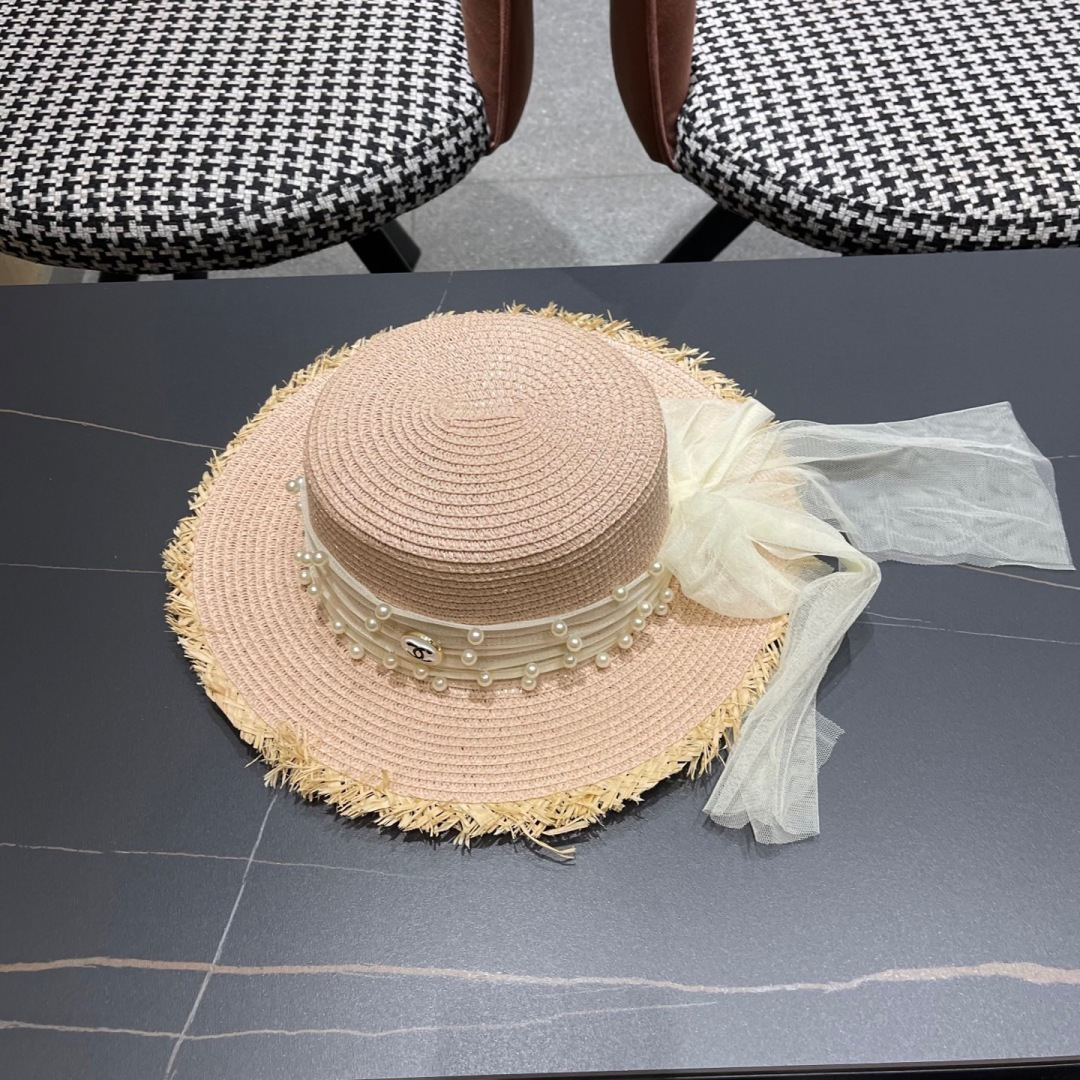  香奈儿Chanel 2025蝴蝶结草编帽子平顶珍珠毛边草帽女大帽檐夏季海
边沙滩遮阳防晒帽