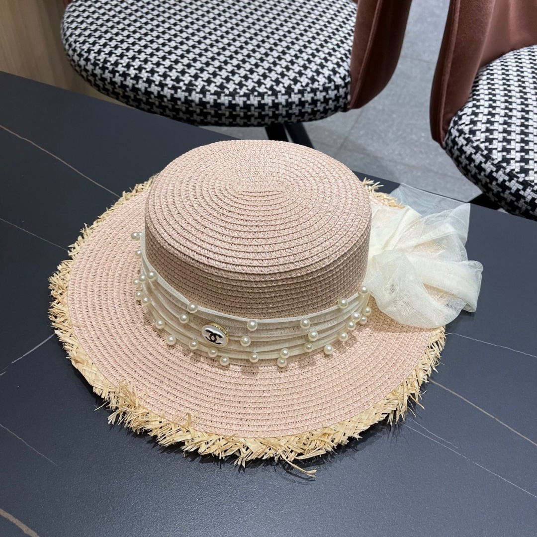  香奈儿Chanel 2025蝴蝶结草编帽子平顶珍珠毛边草帽女大帽檐夏季海
边沙滩遮阳防晒帽