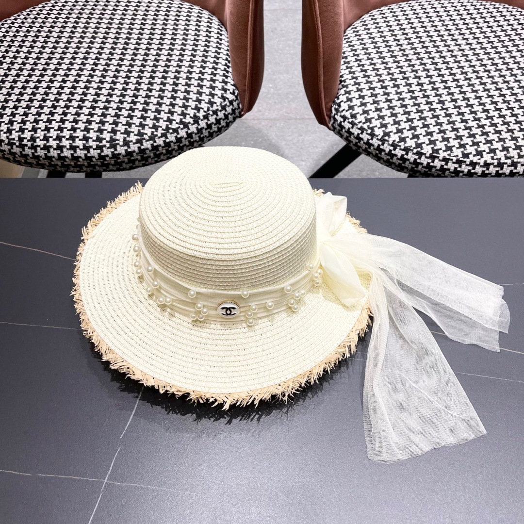  香奈儿Chanel 2025蝴蝶结草编帽子平顶珍珠毛边草帽女大帽檐夏季海
边沙滩遮阳防晒帽
