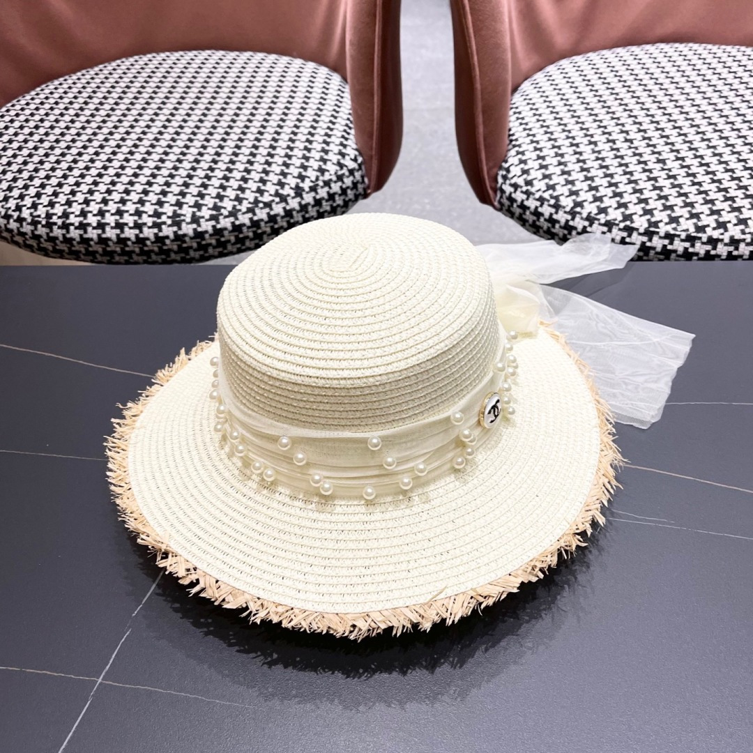  香奈儿Chanel 2025蝴蝶结草编帽子平顶珍珠毛边草帽女大帽檐夏季海
边沙滩遮阳防晒帽