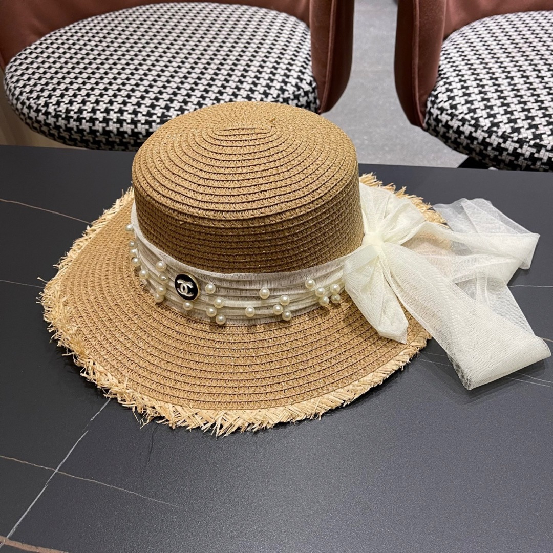  香奈儿Chanel 2025蝴蝶结草编帽子平顶珍珠毛边草帽女大帽檐夏季海
边沙滩遮阳防晒帽