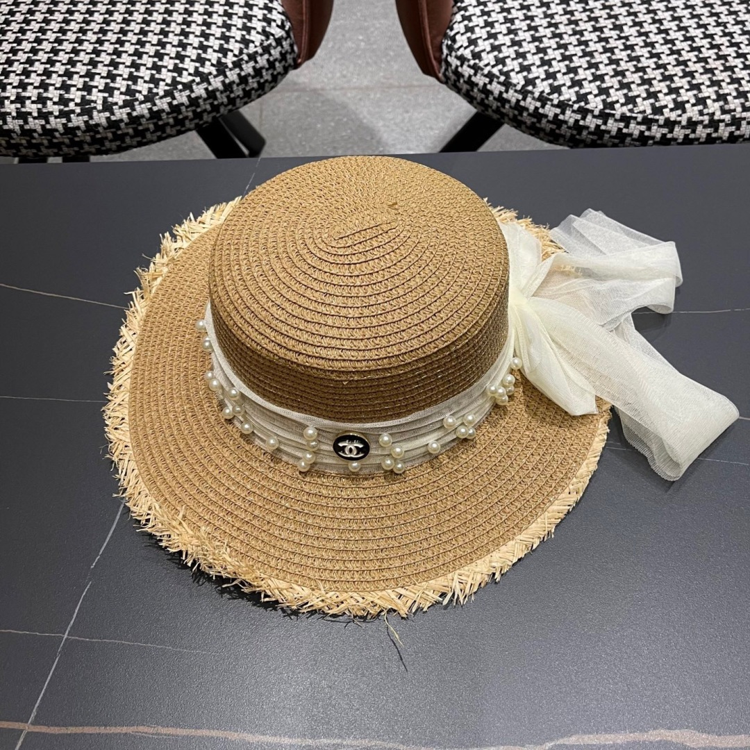  香奈儿Chanel 2025蝴蝶结草编帽子平顶珍珠毛边草帽女大帽檐夏季海
边沙滩遮阳防晒帽