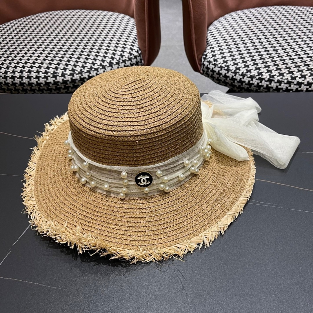  香奈儿Chanel 2025蝴蝶结草编帽子平顶珍珠毛边草帽女大帽檐夏季海
边沙滩遮阳防晒帽