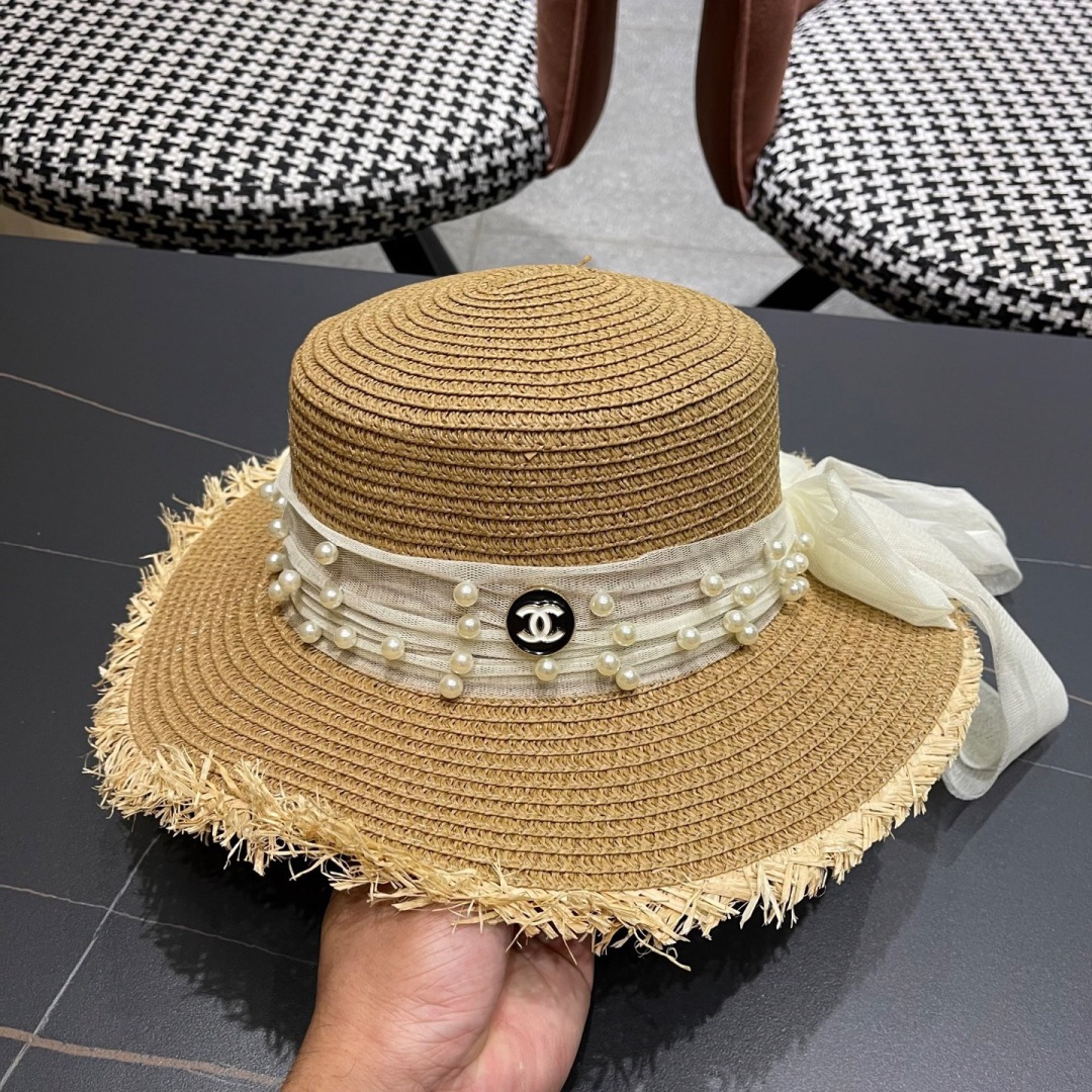  香奈儿Chanel 2025蝴蝶结草编帽子平顶珍珠毛边草帽女大帽檐夏季海
边沙滩遮阳防晒帽