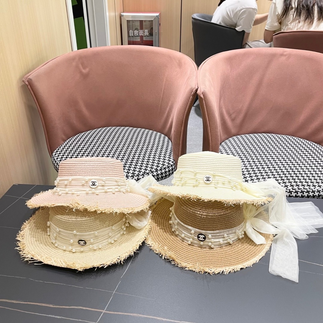  香奈儿Chanel 2025蝴蝶结草编帽子平顶珍珠毛边草帽女大帽檐夏季海
边沙滩遮阳防晒帽