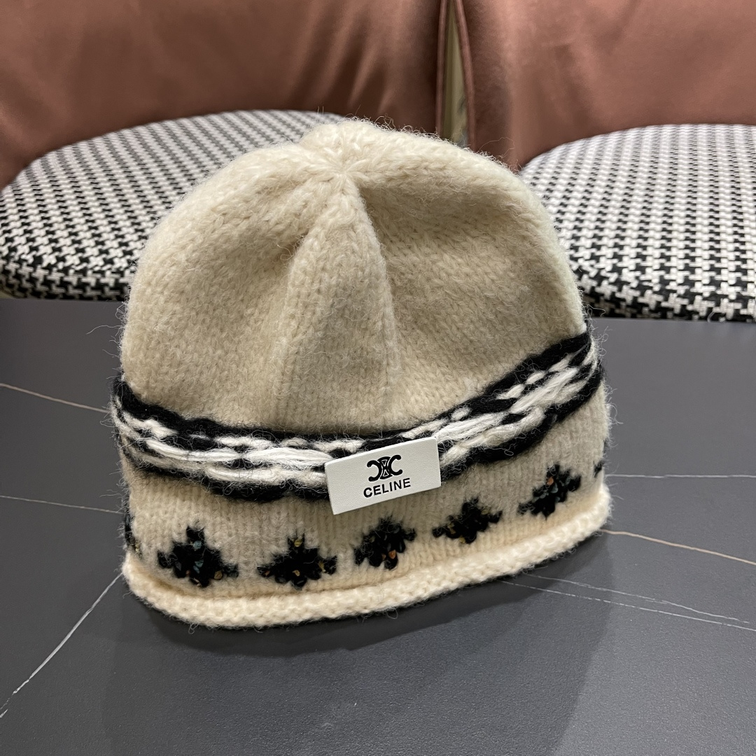  CELINE赛琳 秋冬新款墨调普鲁士蓝包头帽提花自然卷边毛线
帽男女凹造型针织帽