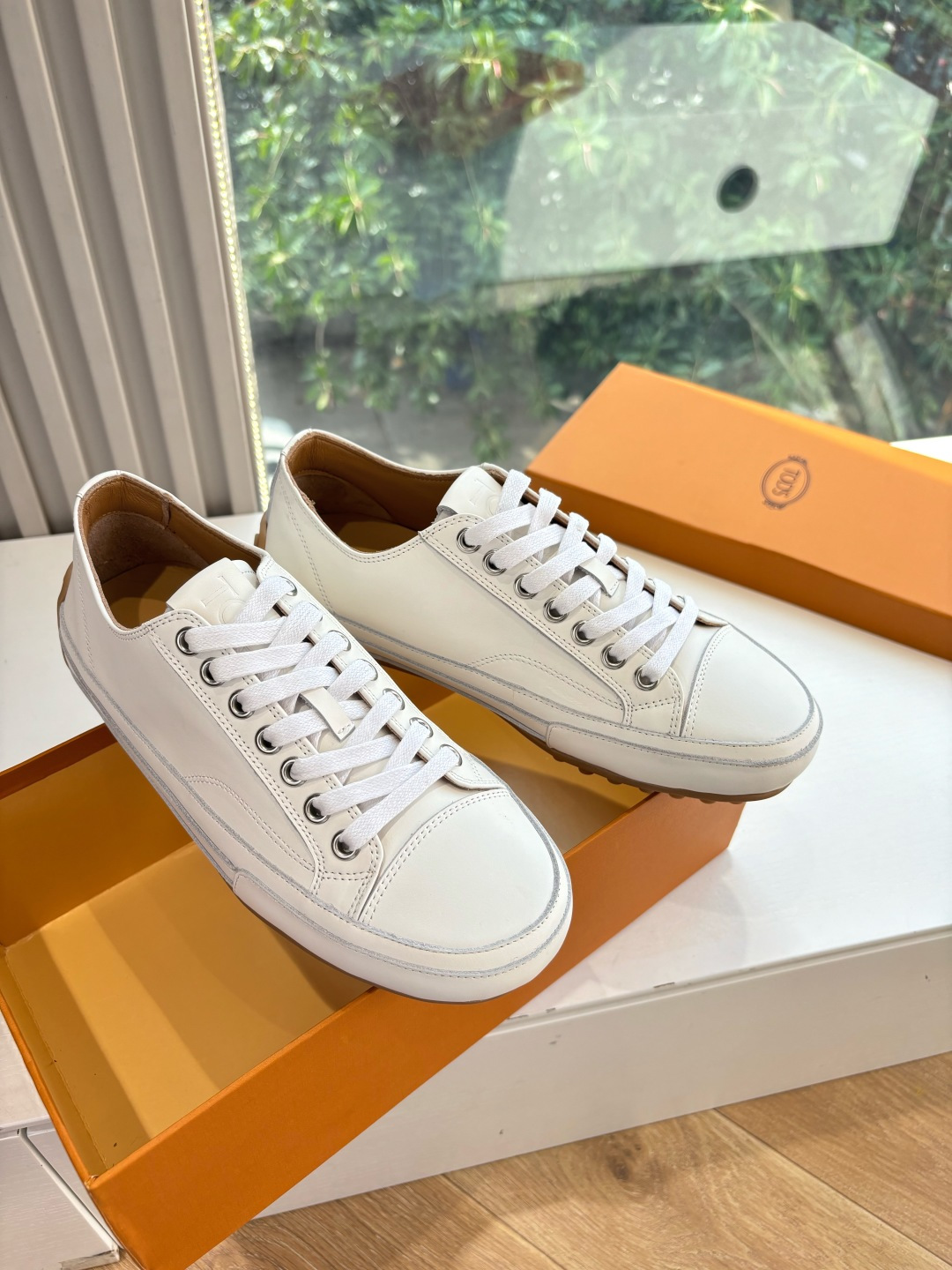 Luxurious Tod’s Silk Sneakers: Quality Leather, Elegant Design for Summer 2025.