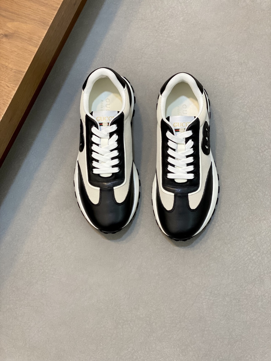 Gucci Leather and Mesh Lace-Up Sneakers - Stylish, Comfortable, and Durable 1 Gucci Men's Leather and Mesh Lace-up Sneakers - Black and White, Comfortable Fit
