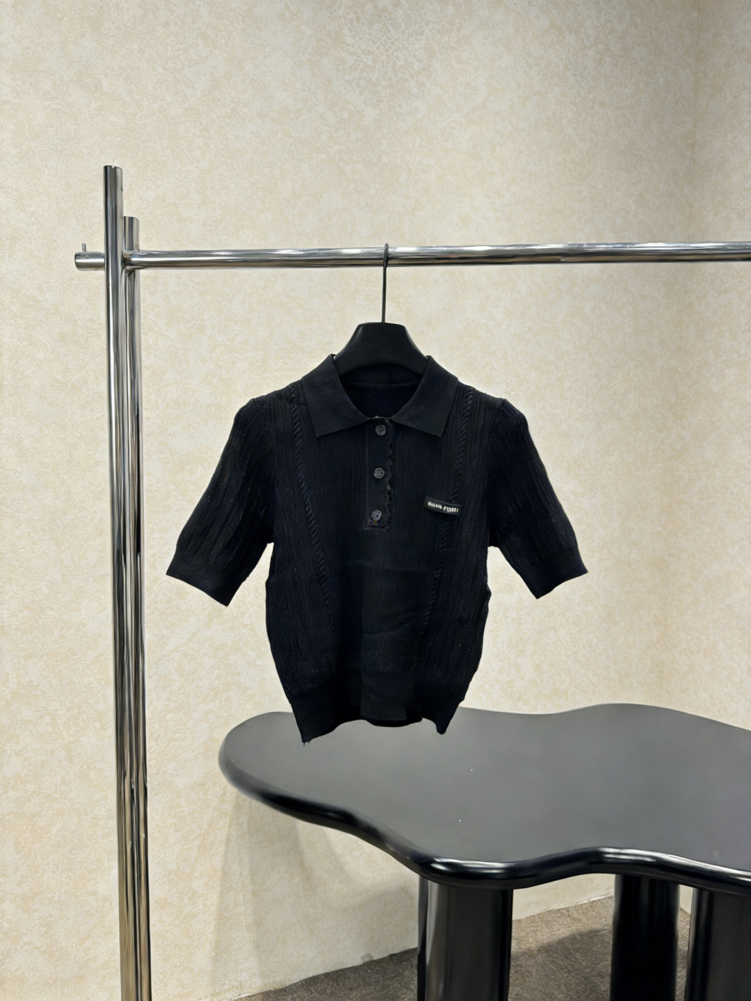 NO:790867,This black knitted Polo collar short-sleeved T-shirt skirt suit is made of vertical striped knitted fabric. It is light and breathable, and is super comfortable to wear in summer. The Polo collar + three buttons design is full of retro college style. The white letter embroidery on the chest is very detailed. It has a straight shoulder cut to modify the shoulder line. Pair it with a pleated skirt or high-waisted pants to easily get an age-reducing and fashionable look. It can be worn for daily commuting and leisure. It is simple and textured. It is a must-have and versatile item in the summer wardrobe!  Size SML,,skirts,T-shirt,tees,t-shirt,19860909这款黑色针织Polo领短袖T恤半裙套装,采用竖条纹针织面料,轻薄透气,夏天穿超舒服,Polo领+三颗纽扣设计,复古学院风满满,胸前白色字母刺绣超有细节感,正肩剪裁,修饰肩部线条,搭配百褶裙或高腰裤,轻松get减龄时髦look,日常通勤、休闲都能穿,简约又有质感,是夏季衣橱必备百搭单品！码数SML,,skirts,T-shirt,tees，t-shirt,,Women's clothing