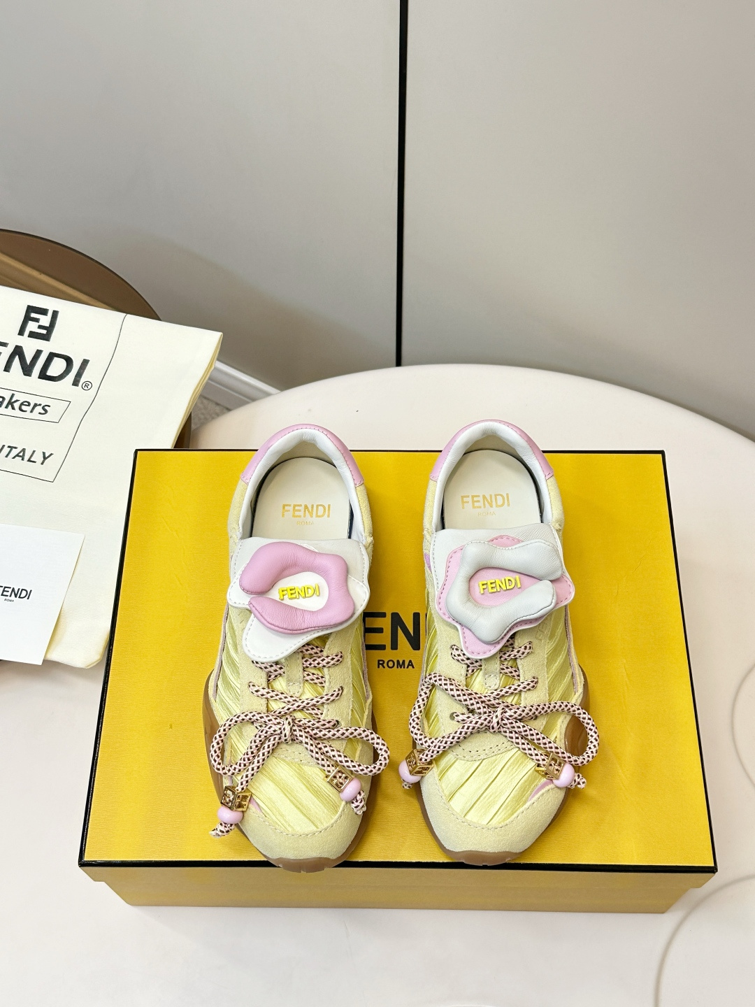 NO:780803,FENDI 2026SS limited edition sports shoes FENDI 2026SS limited edition sports shoes, made in Italy, suede + fabric splicing, light yellow main color with pink and purple details, fresh and fashionable. The shoelaces are the brand's iconic webbing, which is highly recognizable!  The TPU rubber sole has strong grip and is suitable for daily wear or light sports. There are FENDI logos on the tongue and side of the shoe. They are limited edition and have full collection value. They are perfect for those who pursue individuality and quality!  Upper suede + fabric stitching, lining sheepskin, size 35-40, casual shoes/sports shoes, fendi, sneakers, sheepskin, chamois leather19860909FENDI 2026SS限量运动鞋 FENDI 2026SS限量运动鞋,意大利制造,麂皮+织物拼接,浅黄主色配粉紫细节,清新又时髦.鞋带是品牌标志性织带,辨识度超高！ TPU橡胶鞋底抓地力强,日常穿搭或轻运动都OK.鞋舌&鞋侧有FENDI Logo,限量发售,收藏价值满分,超适合追求个性和品质的你！ 鞋面麂皮+织物拼接 内里羊皮 码数35-40,休闲鞋/运动鞋,fendi,sneakers,sheepskin,chamois leather,Women's Shoes