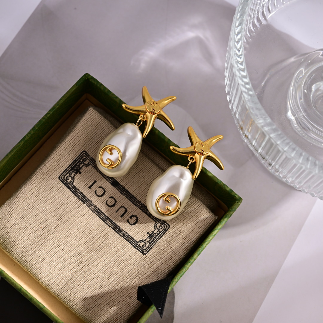 Elegantes Pendientes Gucci con Diseño de Estrella de Mar y Perla con Logo 4 cmp i1752242790391 443 0 2