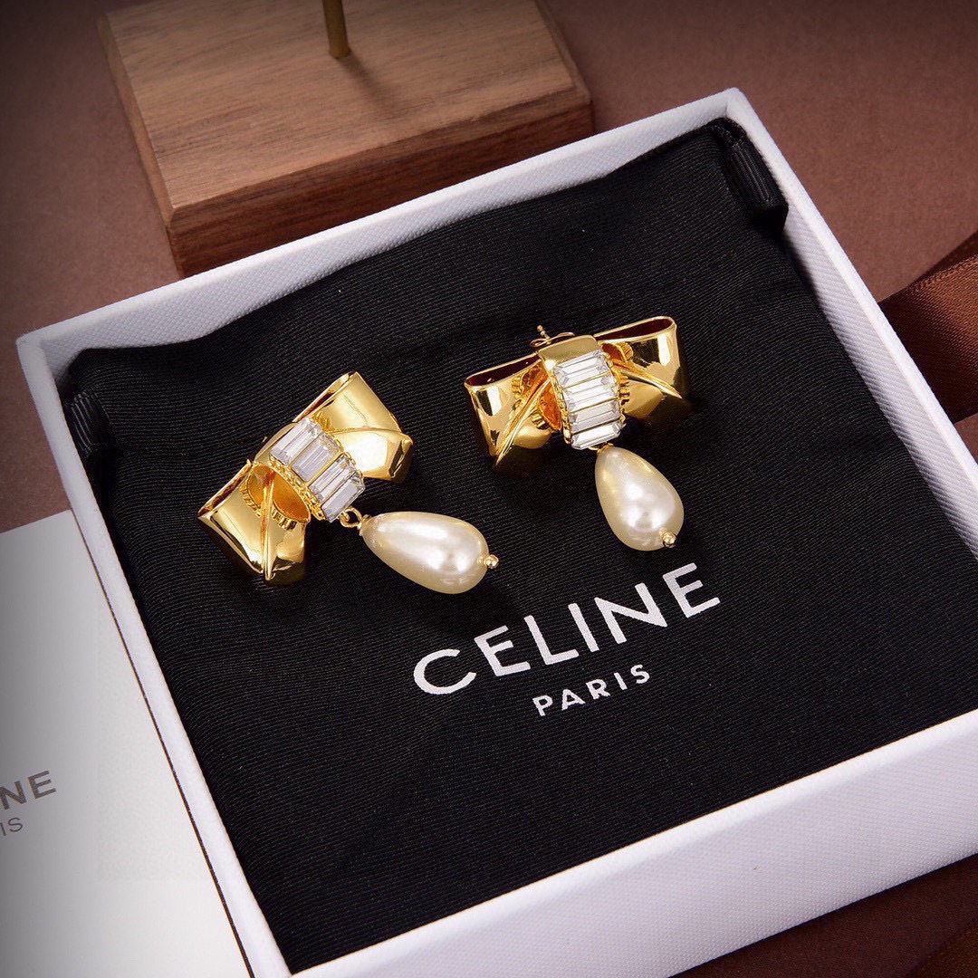 Celine Chic Bow Pearl Drop earrings gold-tone metal clear baguette-cut crystals cream teardrop faux pearl 3 2cm drop length
