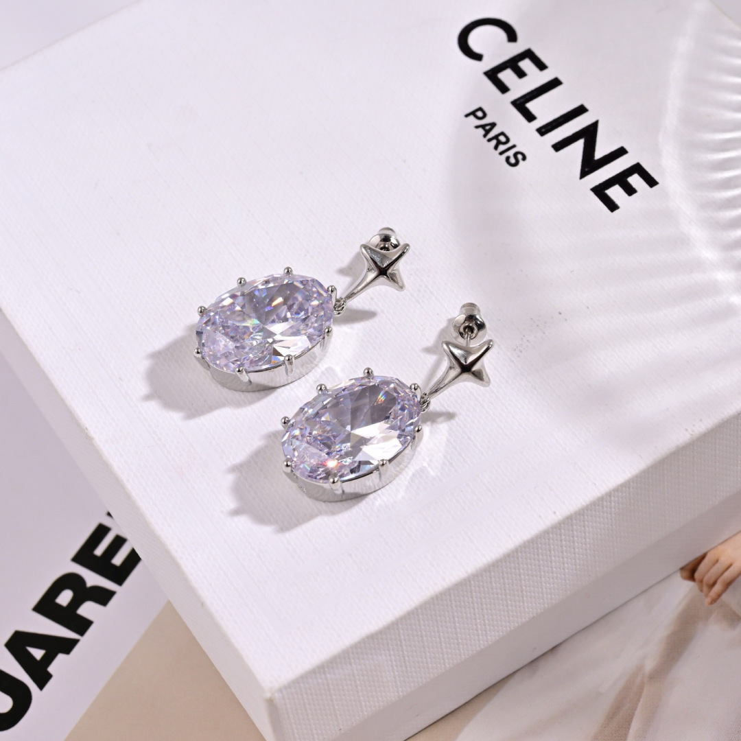Celine Star Drop Oval Crystal earrings silver-toned metal with clear faceted crystal 2 5cm drop length
