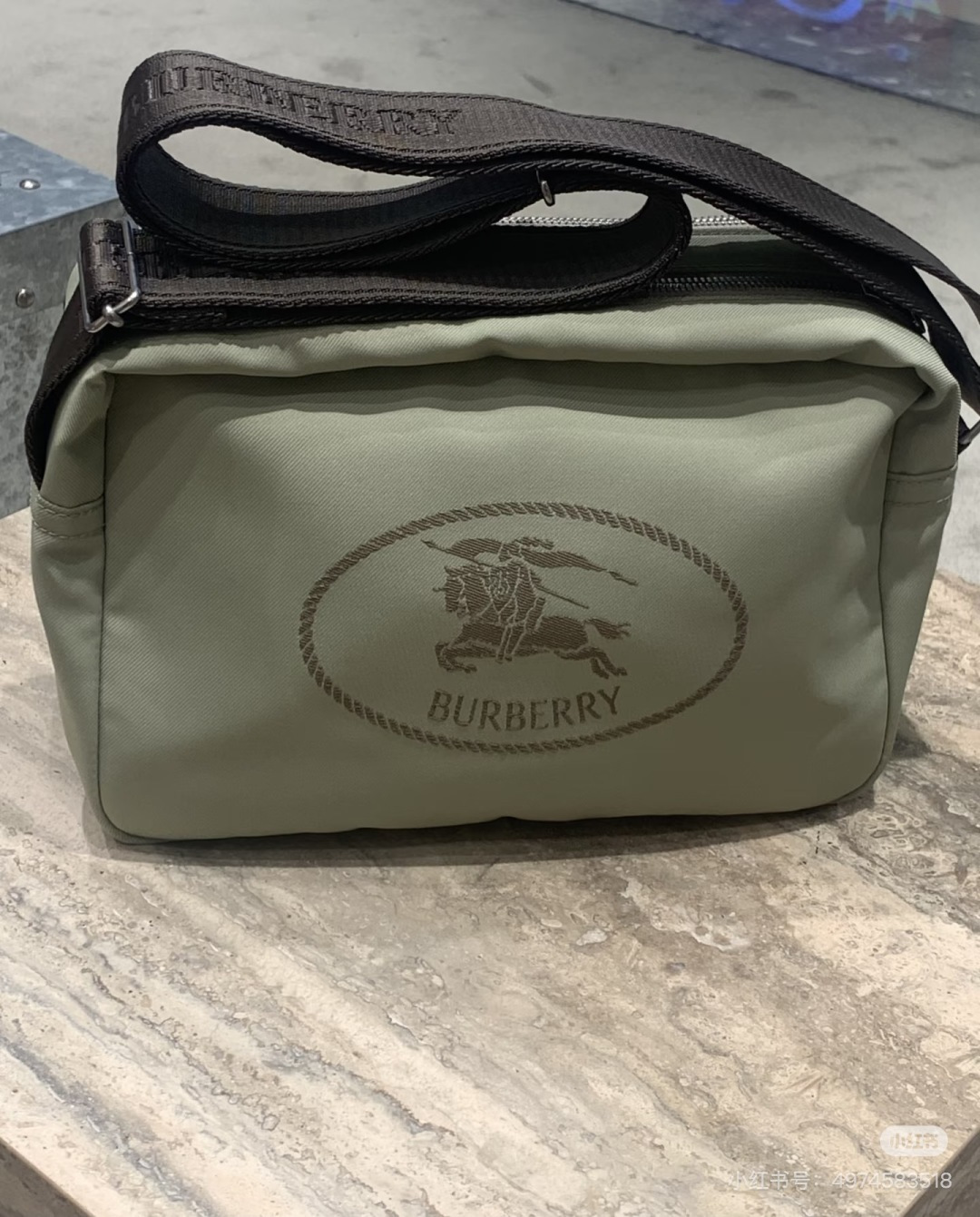 Burberry B's nylon crossbody bag is lightweight and durable, with the classic knight logo embroidered on the front, making it highly recognizable