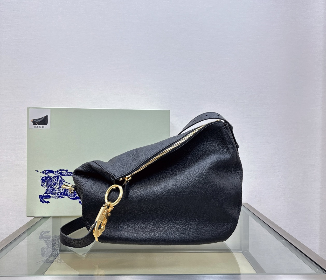Burberry’s latest Cavalier War bag is made of grained calfskin fabric. Shoulder strap with